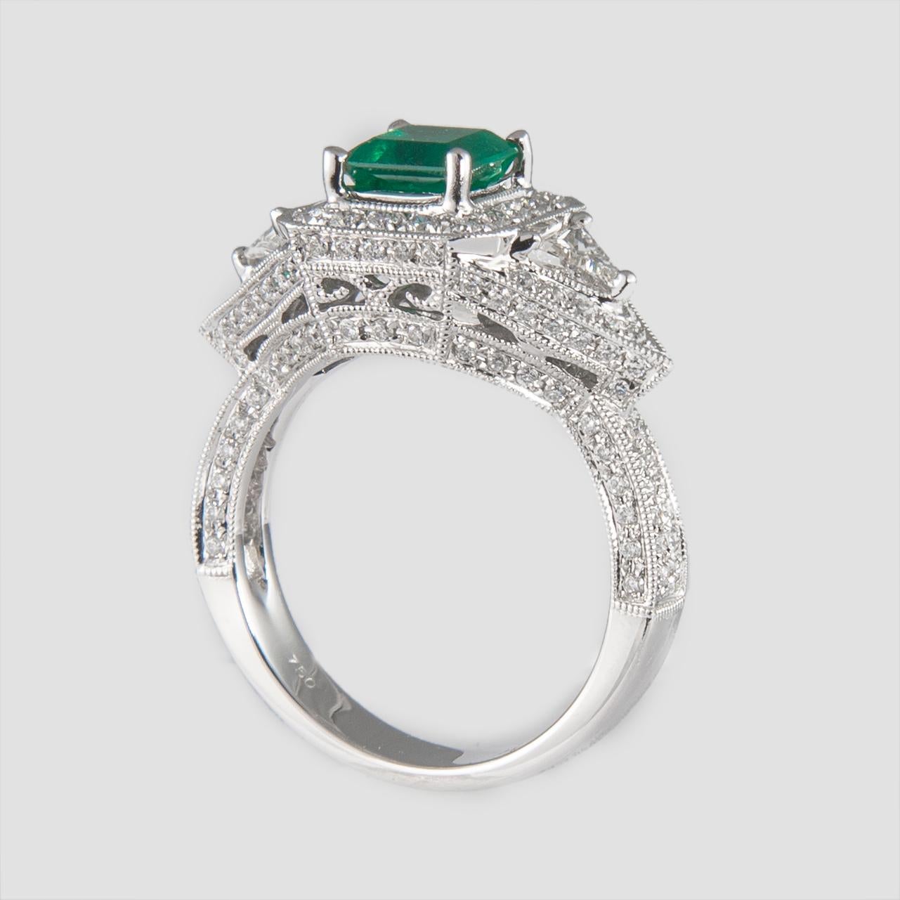 Women's 1.08 Carat Emerald Three-Stone Diamond with Halo Ring 18 Karat Gold For Sale