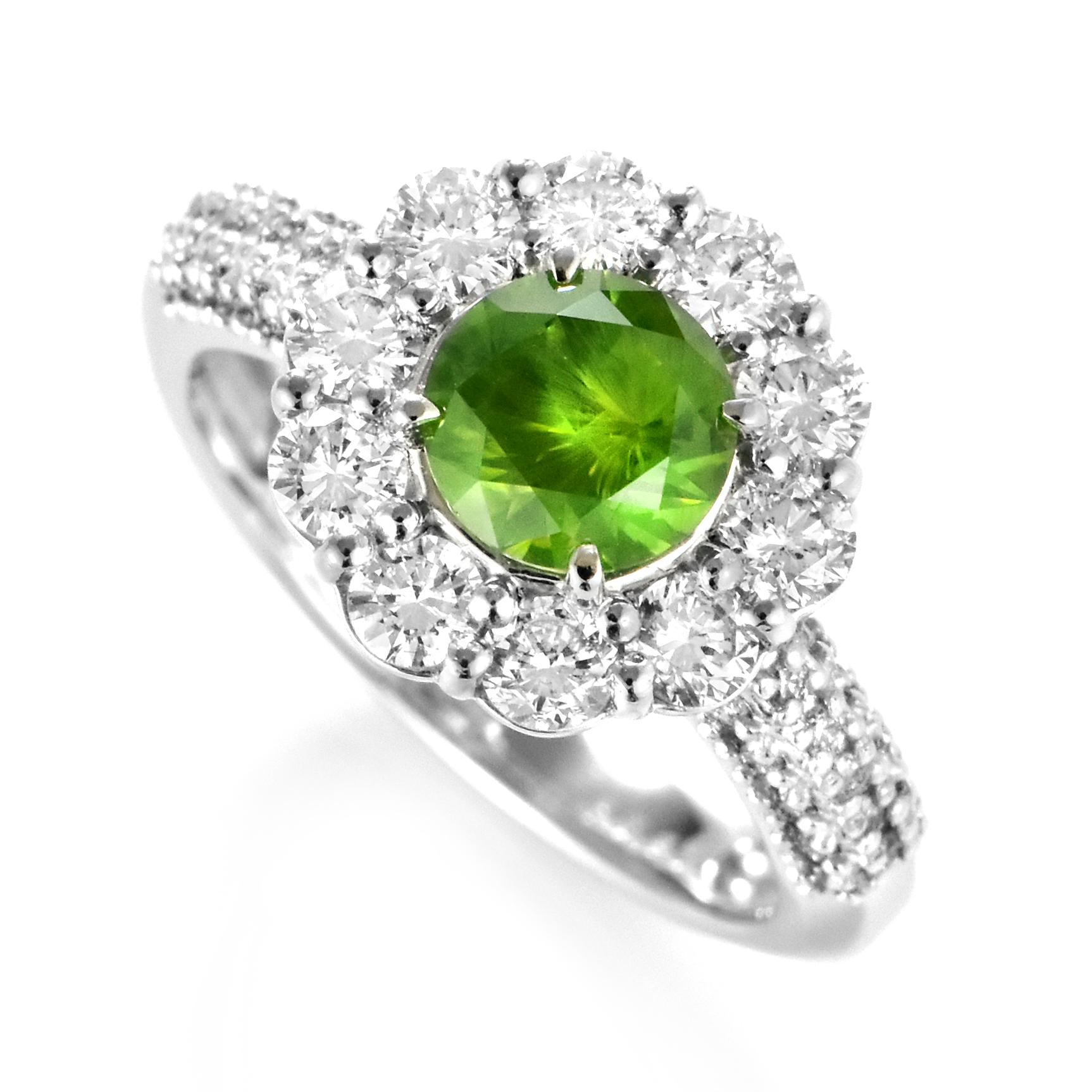 A beautiful cluster ring featuring a 1.08 Carat, Natural Demantoid Garnet and 0.97 Carats of Diamond Accents set in Platinum. Demantoid Garnet's only known source used to be the Ural Mountains in Russia however recent discoveries in Africa have