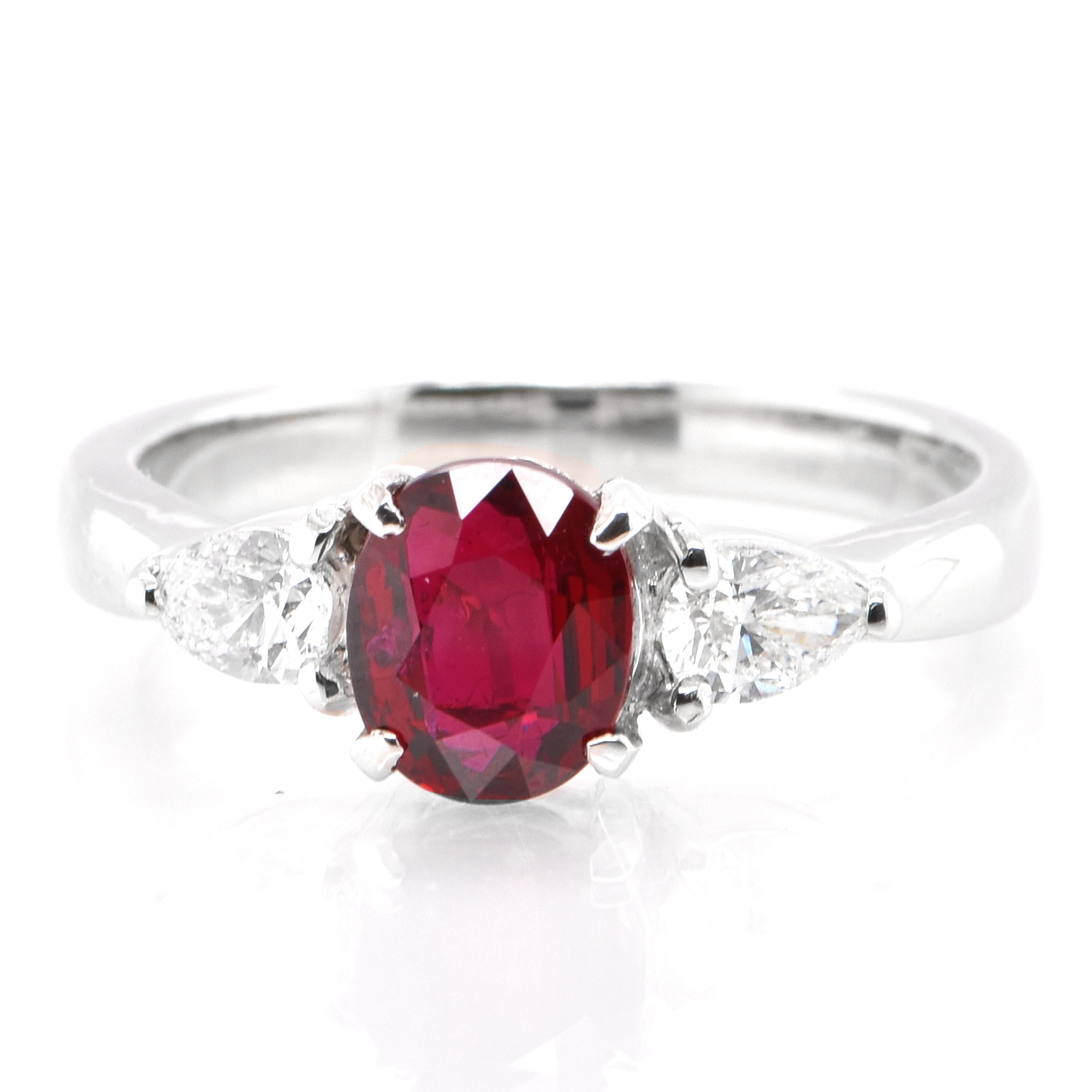 A beautiful ring set in Platinum featuring a 1.084 Carat Natural Ruby and 0.34 Carat Diamonds. Rubies are referred to as 