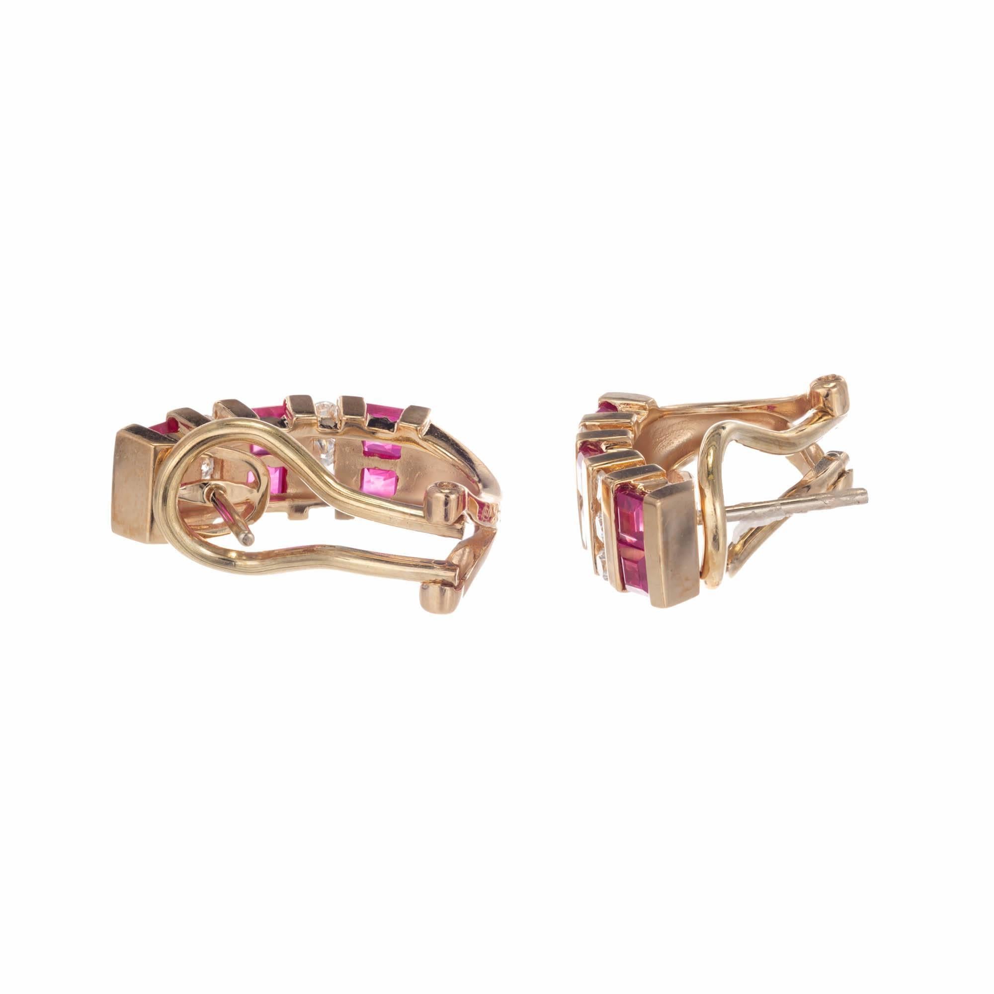 14k Yellow gold ruby and diamond earrings. Square cut rubies are channel set in a row and divided by a row of channel set round diamonds in a half hoop design with a post and omega back.

12 square step cut rubies 2.5mm Approximate .84 carats
12