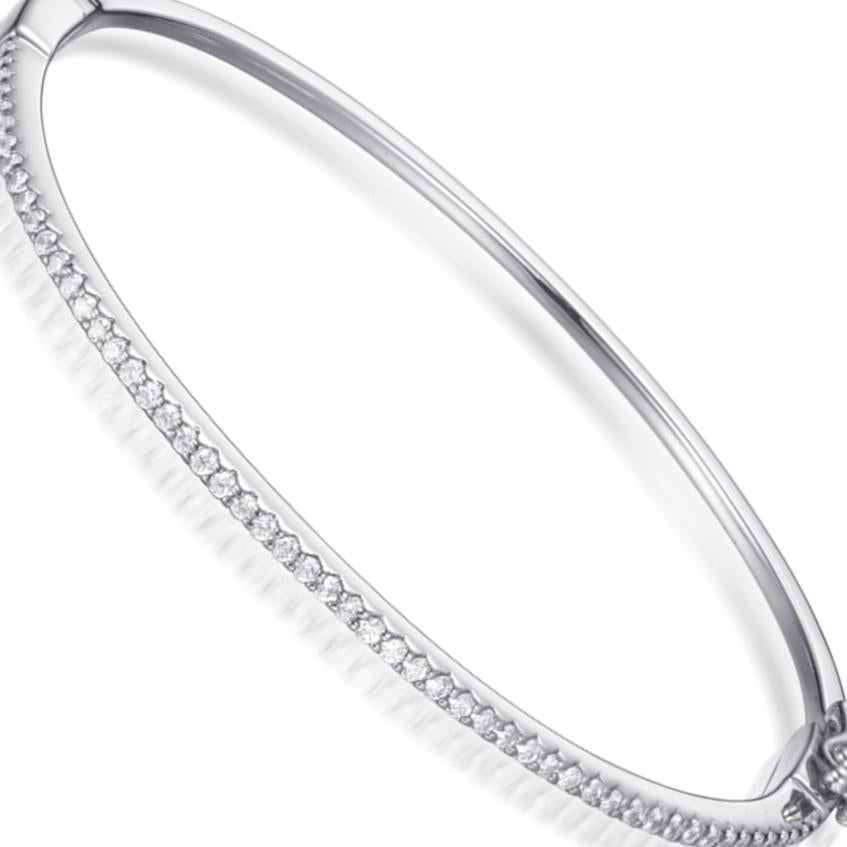 A subtle, understated yet elegant bangle that is easy to wear, effortlessly lifting any outfit to another level. 

Featuring 1.08ct of round brilliant cut cubic zirconia, hand set in 925 sterling silver with a luxurious high gloss white rhodium