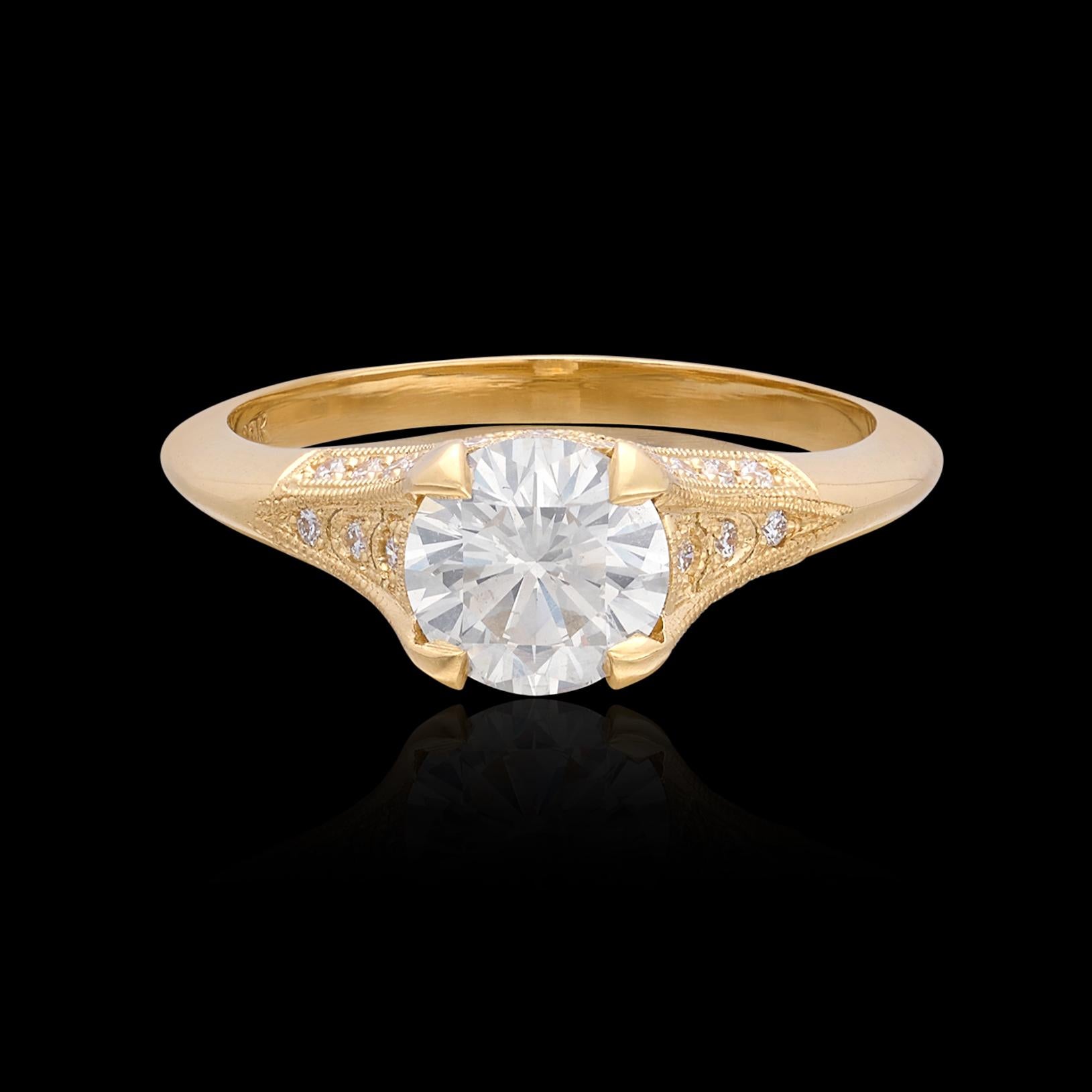 Inspired by Art Deco design, the 18k yellow gold engagement ring features a round brilliant-cut diamond weighing 1.08 carats (+/- H/SI1), set in a delicately pierced mounting set with 34 round brilliant-cut diamonds, for a total ring weight of 1.31