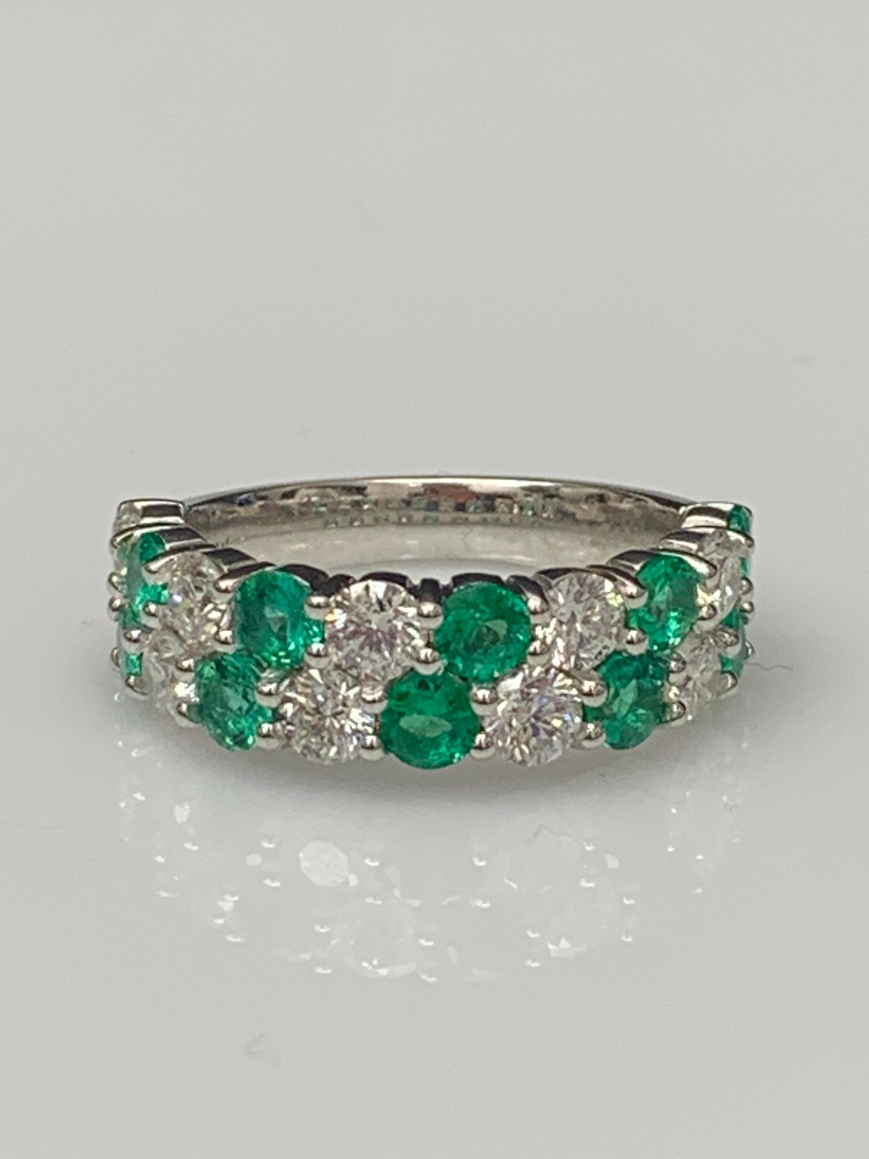 A unique and fashionable ZicZac ring showcasing two rows of round-shape 10 emerald and 9 diamonds, set in a band design. Emerald weighs 1.08 carats and Diamonds weigh 1.52 carats total. A brilliant and masterfully-made piece.

Style available in
