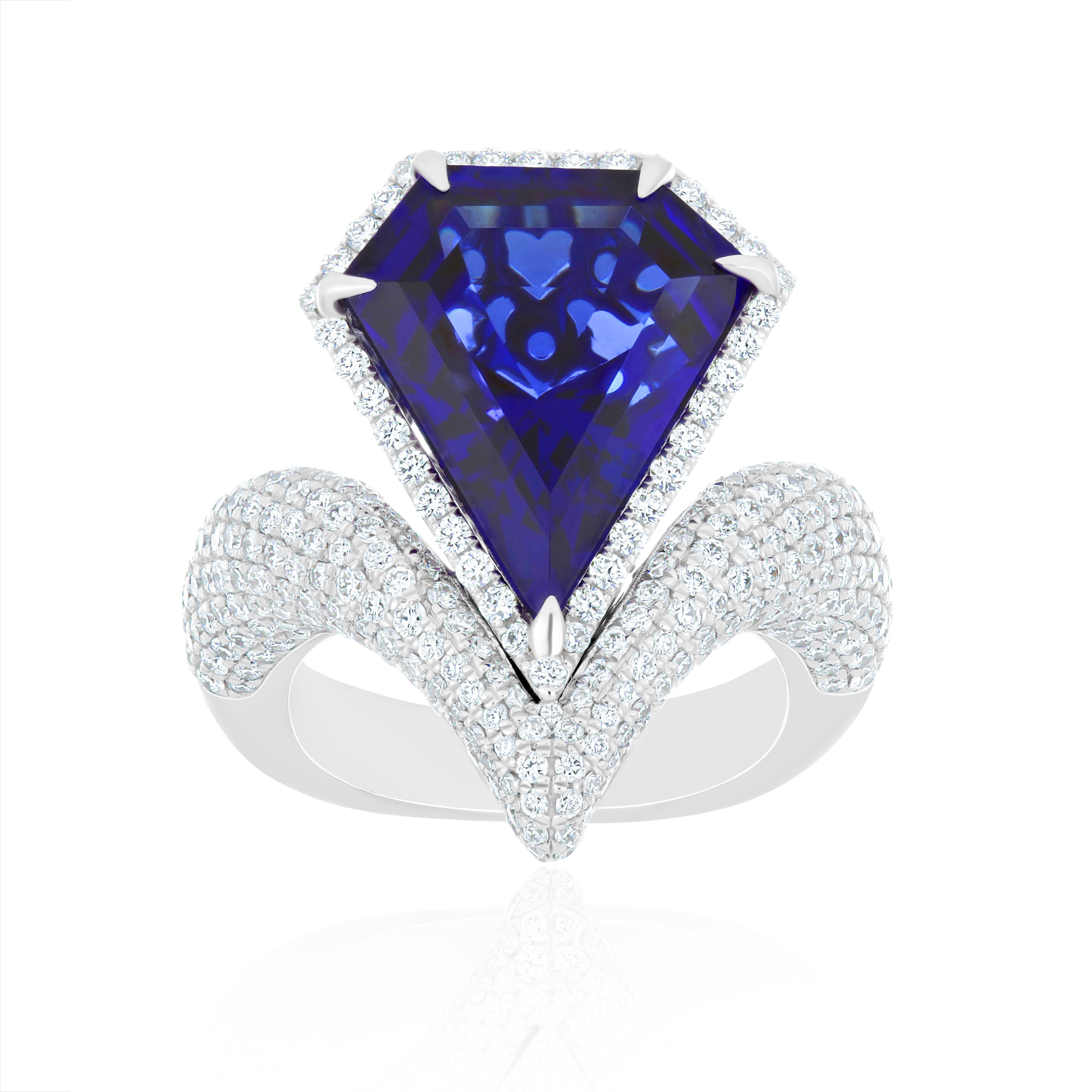 Elegant and Exquisitely detailed White Gold Ring, with a rare 10.8 Cts (approx.) Fancy Shape in faceted Cut 
Tanzanite set in the center beautifully accented with Micro pave set Diamonds, weighing approx. 2.2 CT's (approx.). total carats weight the