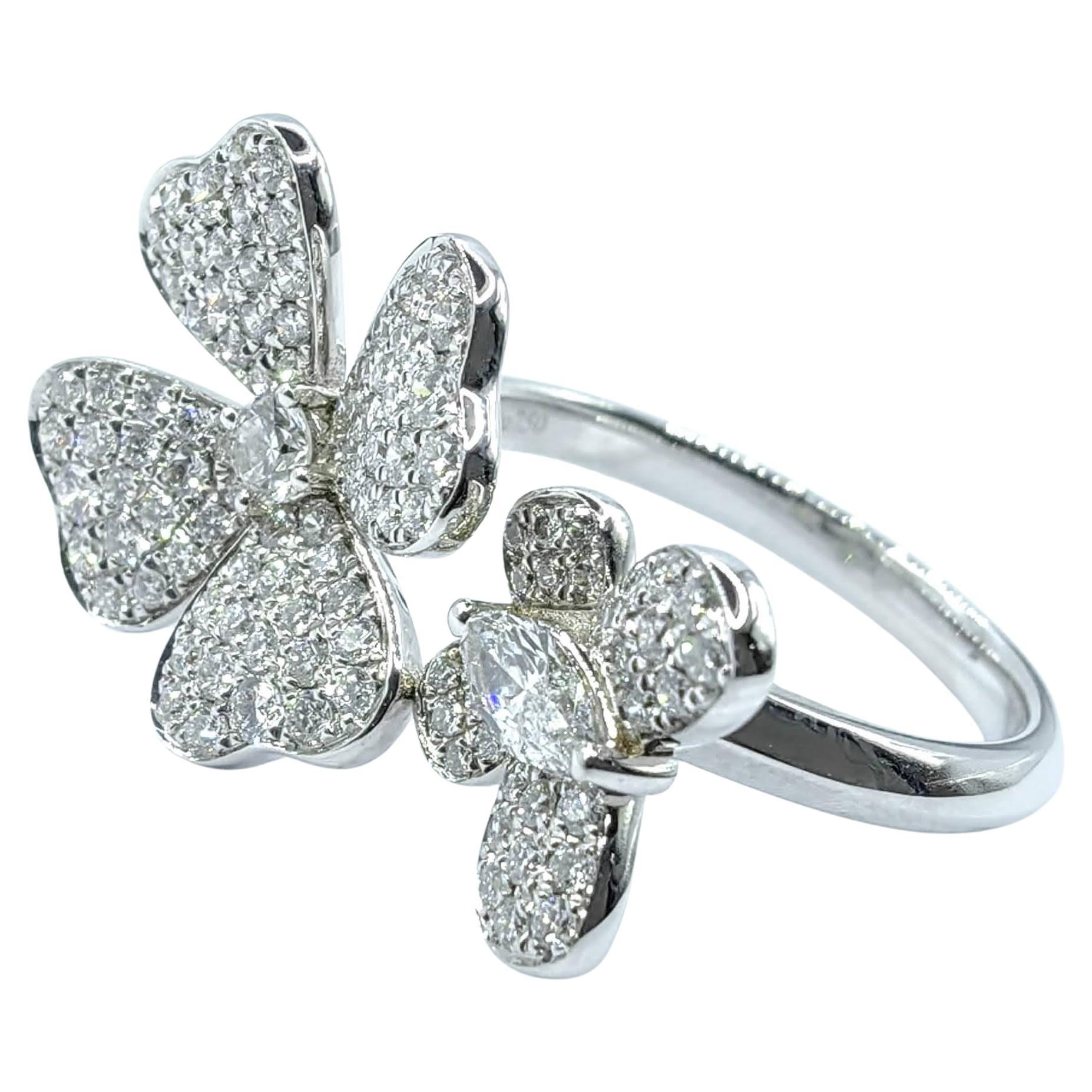 Bring a touch of whimsical elegance to your jewelry collection with this enchanting open-style diamond ring, featuring a delicate flower and graceful butterfly motif. Expertly crafted in luminous 18K white gold, this design artfully balances charm