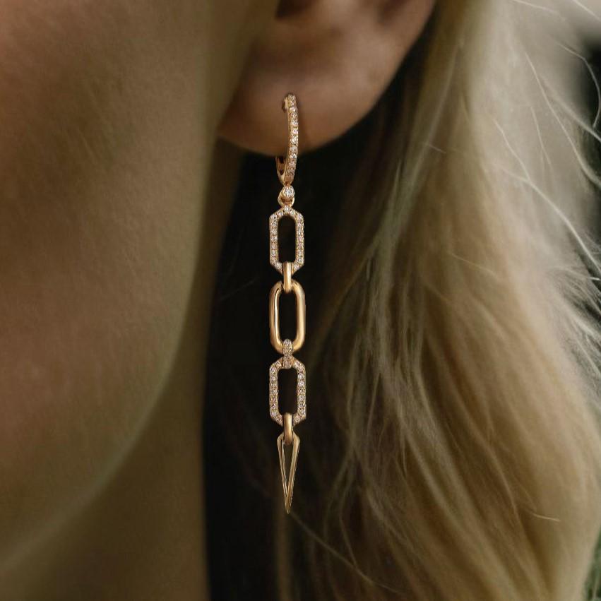 These beautiful drop earrings feature natural diamonds set in 14K yellow gold. Weighing 5.16 grams, they are designed to captivate with their subtle brilliance. The earrings are adorned with 0.36 carats of diamonds, delivering a sparkling touch to