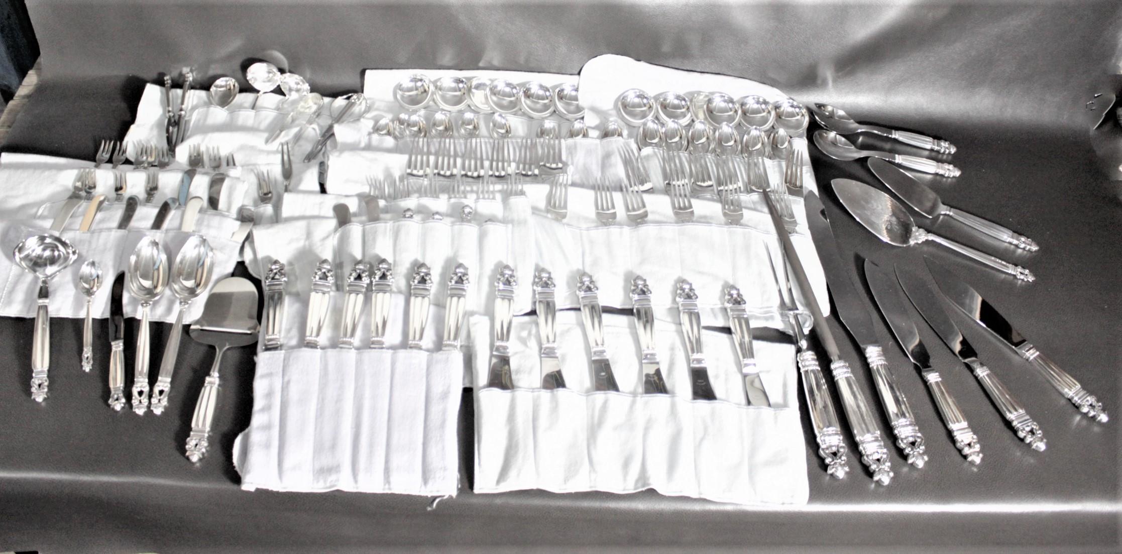 This extremely large sterling silver flatware set was made by Georg Jensen in Denmark in circa 1960 in an Art Deco style. This is Jensen's 'Acorn' pattern and is a complete service for twelve with several considerably rare serving pieces, such as