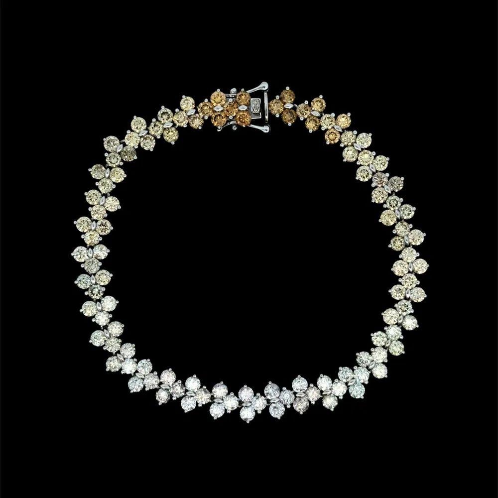 Simply Beautiful! Finely detailed unique design, Hand crafted 14K White Gold Diamond Link Bracelet. This luxurious Bracelet features, 108 Sparkling Round Brilliant Cut White and Fancy Color Diamonds with an approx. total Diamond weight of 9.00