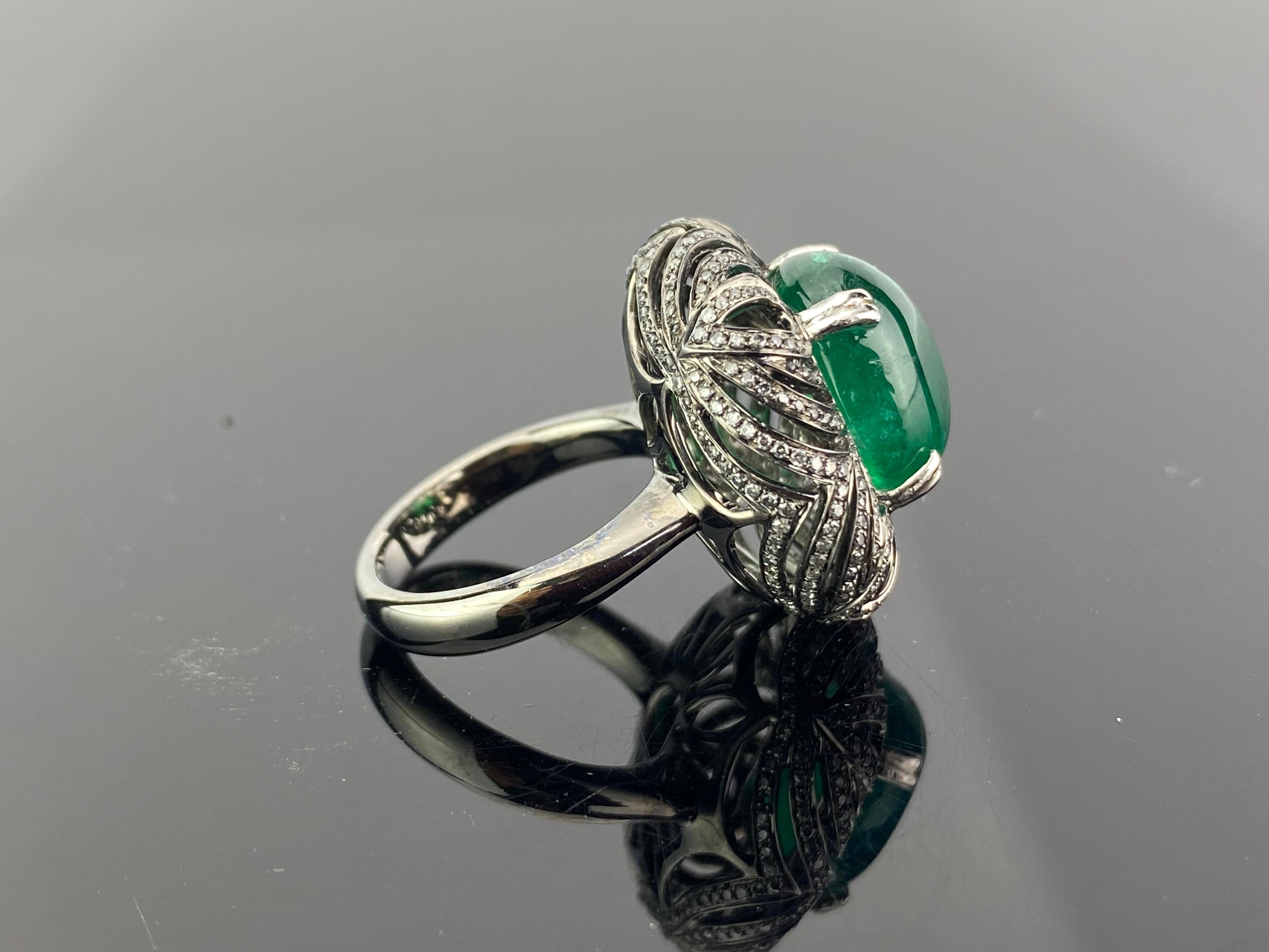 A very unique 10.80 carat Zambian Emerald and 1.36 carat White Diamond ring, set in 13.8 grams solid 18K Gold polished with Black Rhodium. Currently sized at US 7, can be altered. 
We provide free shipping. And we accept returns!