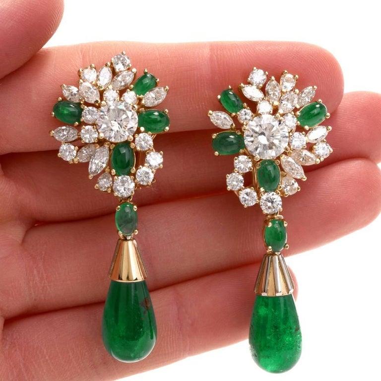 These exquisite high jewelry Diamond & Emerald Earrings are crafted in solid 18K Yellow Gold. They are centered with 2 genuine very nice large round cut diamonds approx: 3.85 carats, G-H color, very nice SI2  clarity (no black inclusion, only white