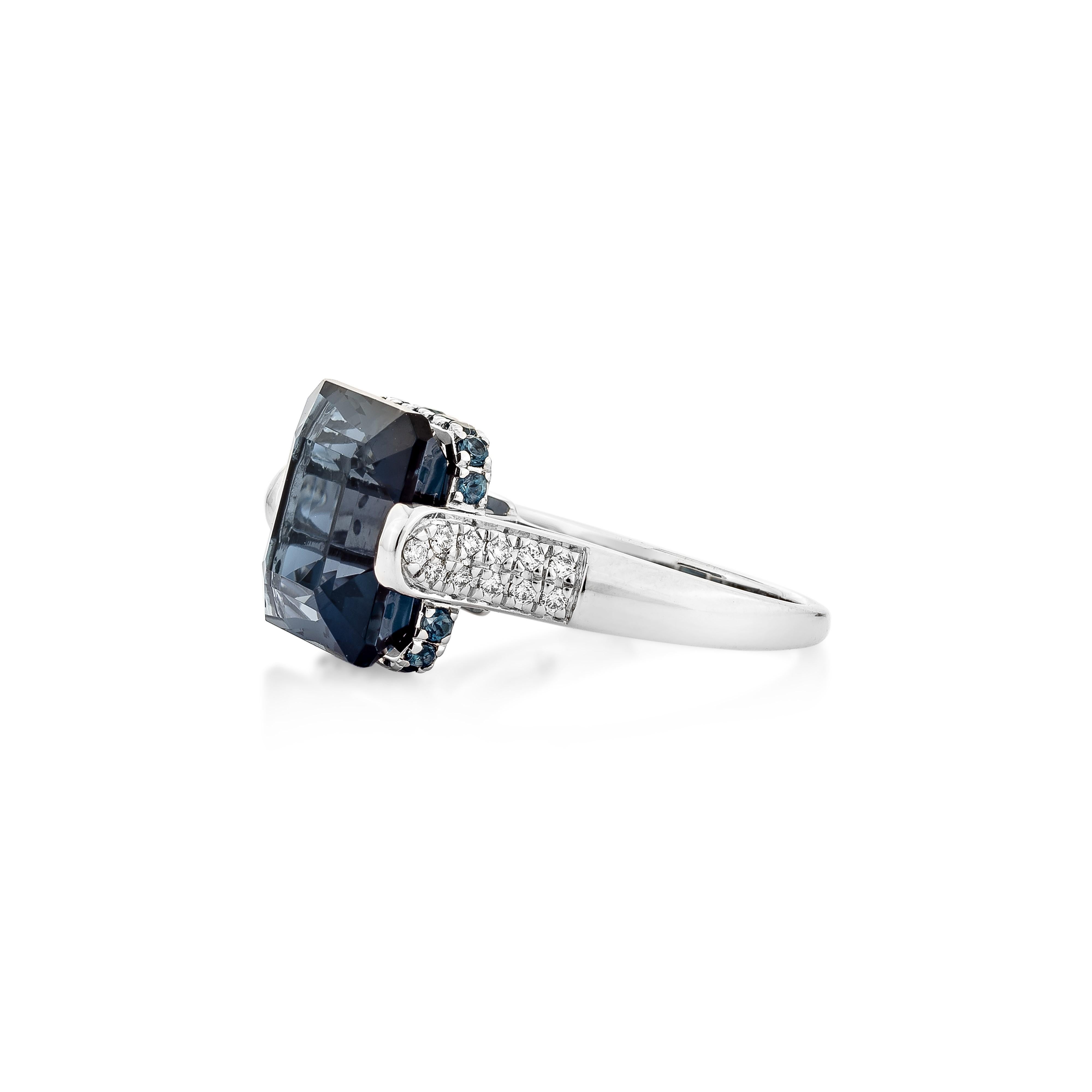 Octagon Cut 10.81 Carat London Blue Topaz Fancy Ring in 18KWG with White Diamond. For Sale