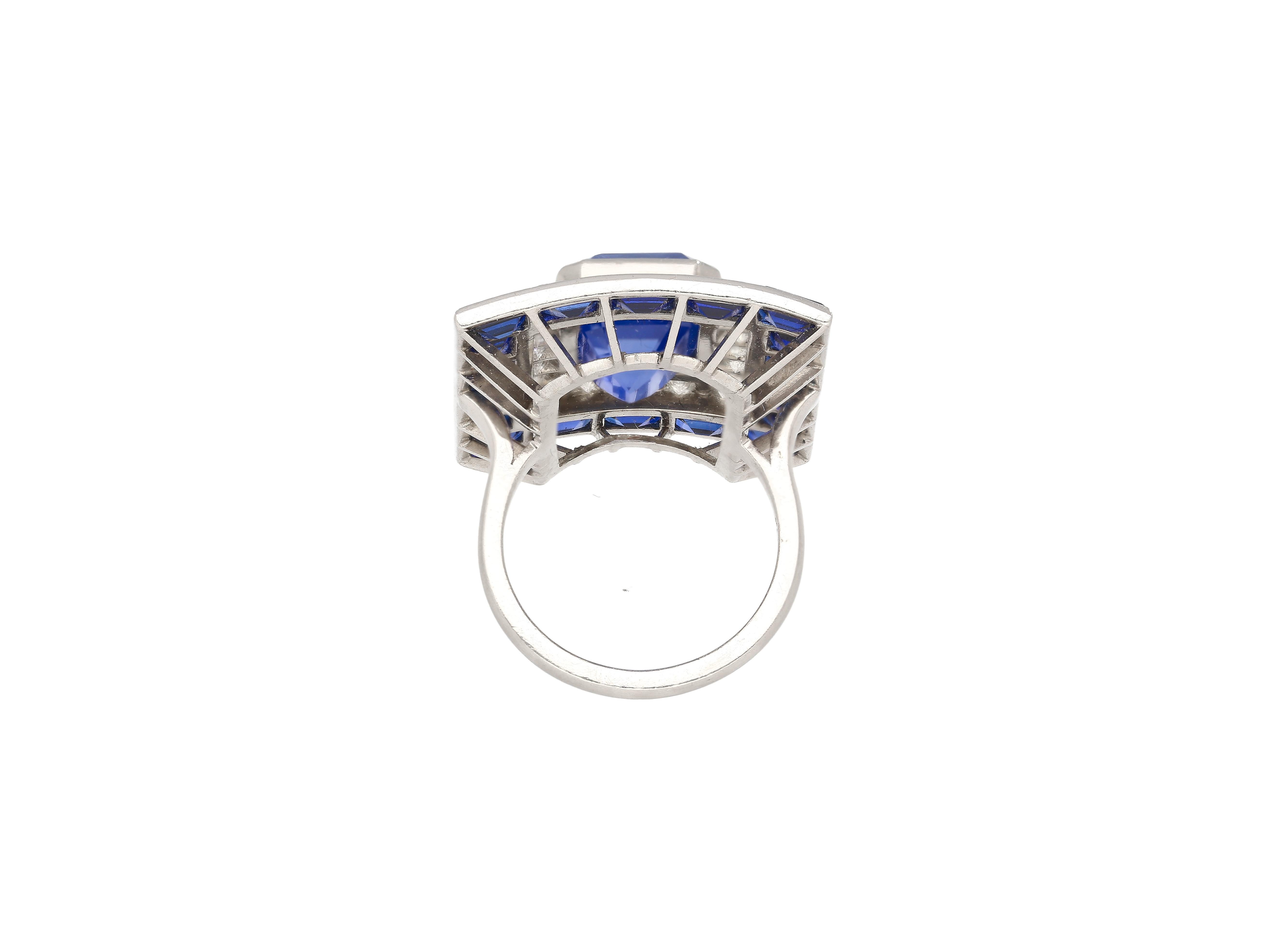 Presenting an exquisite Art Deco Platinum Ring, featuring a 10.82 carat emerald-cut no heat Ceylon Blue Sapphire, certified by GIA and AGL with treatment and origin report. The center stone is an emerald cut, octagonal shape, a vibrant blue color