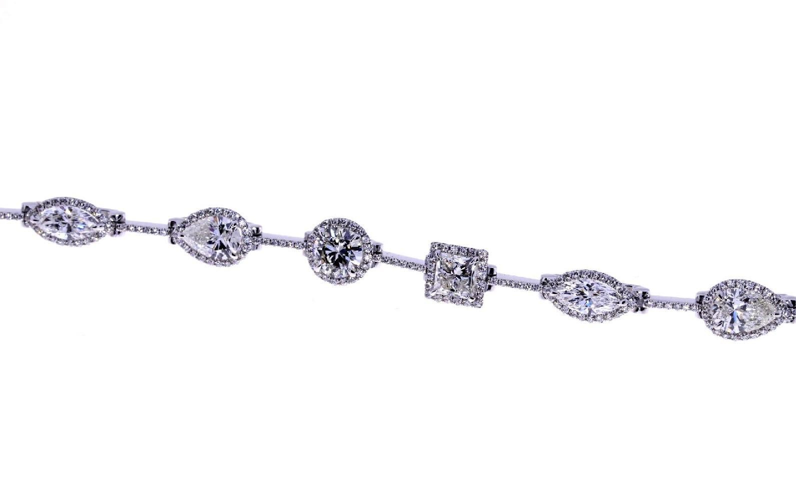 Handmade
18K White Gold
10.83ct Total Diamond Weight
Includes Round, Marquise, Pear, & Princess Cut Diamonds
Designed, Handpicked, & Manufactured From Scratch In Los Angeles Using Only The Finest Materials and Workmanship