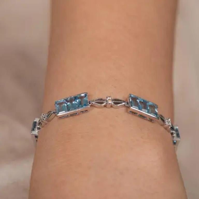 Add a touch of timeless elegance to your jewelry collection with this exquisite Aquamarine and Diamond Tennis Bracelet. Expertly handcrafted in solid 18K white gold, this stunning bracelet features 21 natural aquamarine gemstones, totaling 10.84