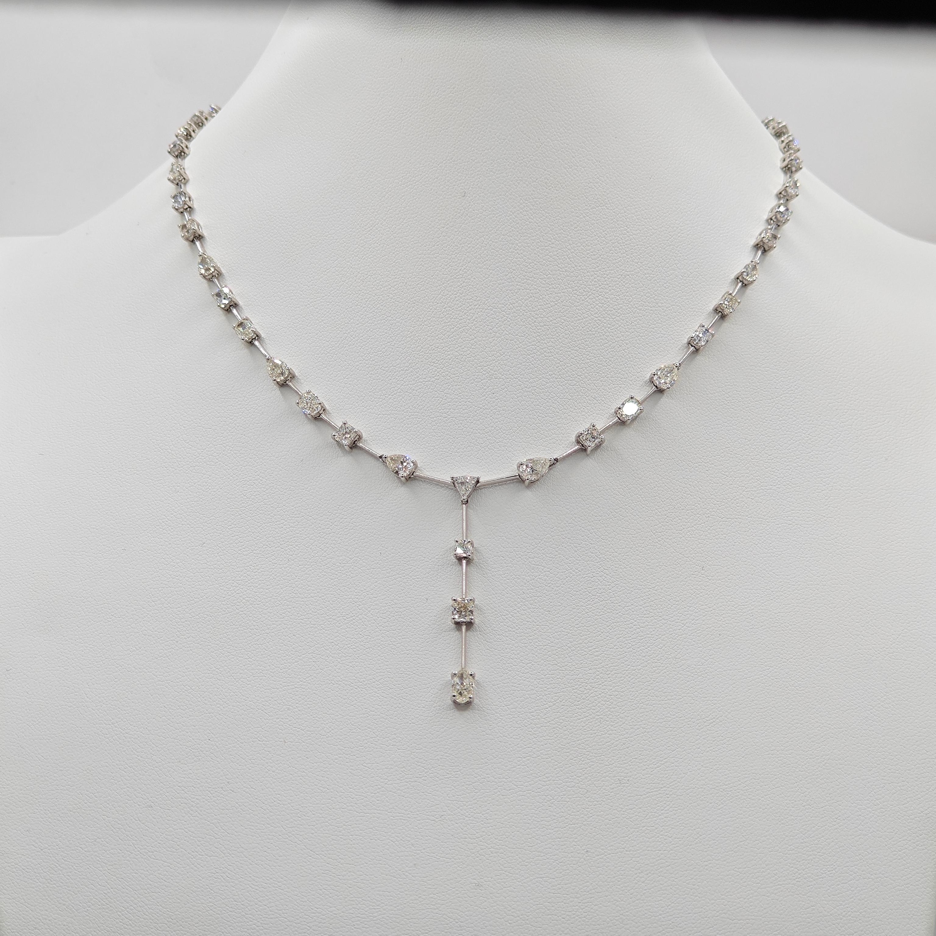 38 Fancy Diamond: 9.25 Carats
10 White Diamonds:  1.60 Carats
Metal: 18K White Gold, 19.10 Grams
