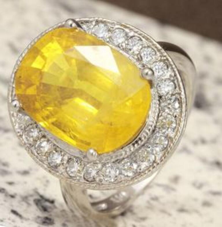 10.85 Carats Exquisite Natural Unheated Yellow Sapphire and Diamond 14K Solid White Gold Ring

Total Natural Unheated Yellow Sapphire Weights: 10.00 Carats

Sapphire Measures: 14.03 x 10.19mm

Natural Round Diamonds Weight: .85 Carats (color F-G /