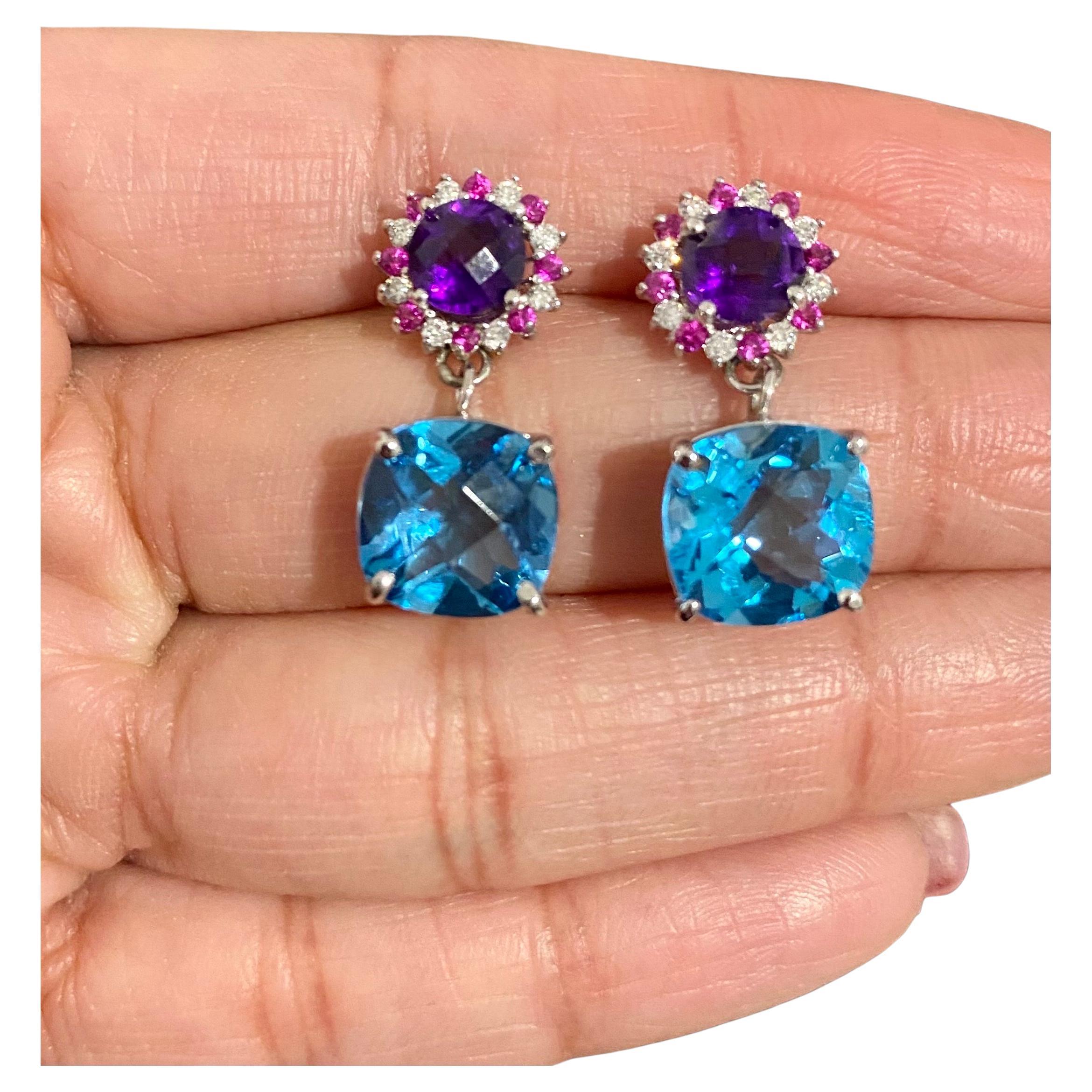 10.87 Carat Natural Amethyst Topaz Sapphire White Gold Drop Earrings

These vibrant Earrings have 2 large Cushion Cut Blue Topaz that weigh 8.81 carats and are embellished with 2 Checkered board cut Amethysts that weigh 1.55 carats and 16 Pink