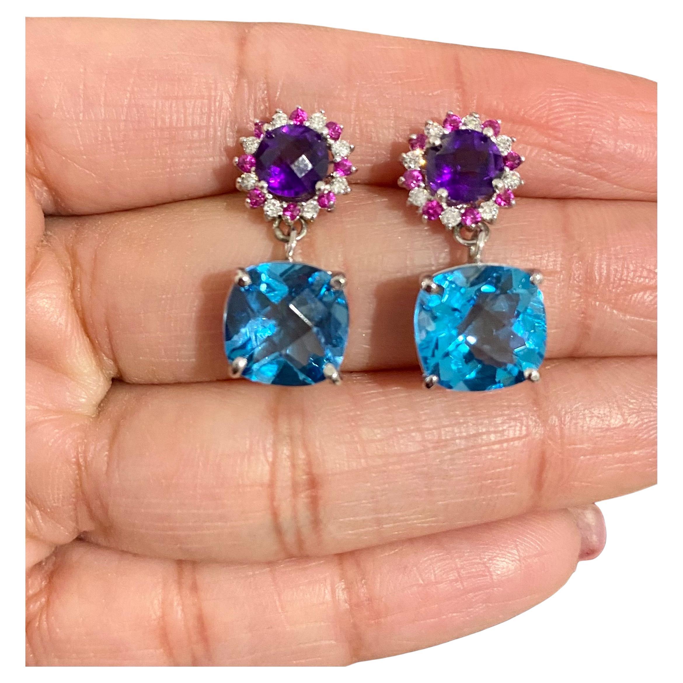 10.87 Carat Natural Amethyst Topaz Sapphire White Gold Drop Earrings

These vibrant Earrings have 2 large Cushion Cut Blue Topaz that weigh 8.81 carats and are embellished with 2 Checkered board cut Amethysts that weigh 1.55 carats and 16 Pink