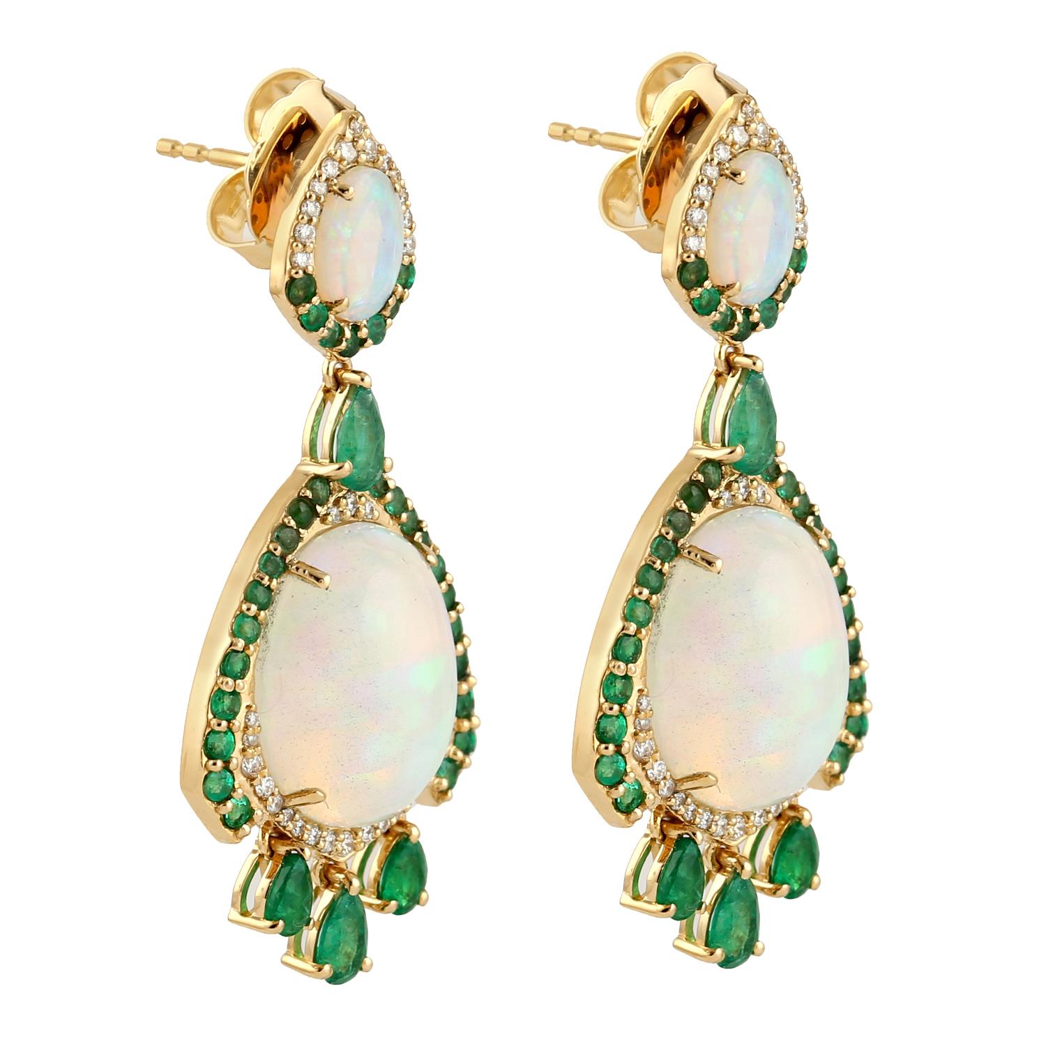 Cast in 18 karat gold. These stud earrings are hand set in 10.87 carats Ethiopian opal, 2.23 carats emerald and .36 carats of sparkling diamonds. 

FOLLOW MEGHNA JEWELS storefront to view the latest collection & exclusive pieces. Meghna Jewels is