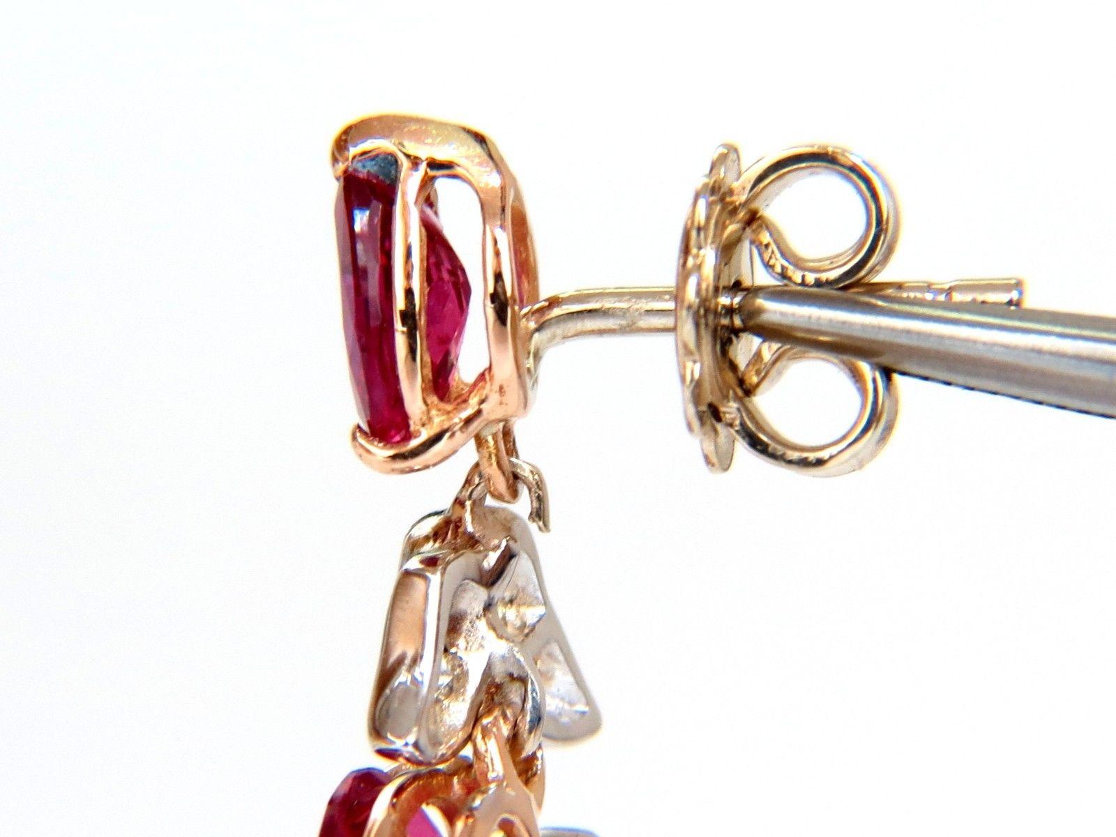Diamond Custer Dangles & No heat Rubies Earrings

10.12ct. Natural Vivid Red Rubies

7.5 X 5.7 - 6.7 x 4.7 (range)

Full cut Pear brilliants.

Excellent, clean clarity & transparent

The Fine Pigeon Blood. 

(1) Ruby checked with GIA 

Report: