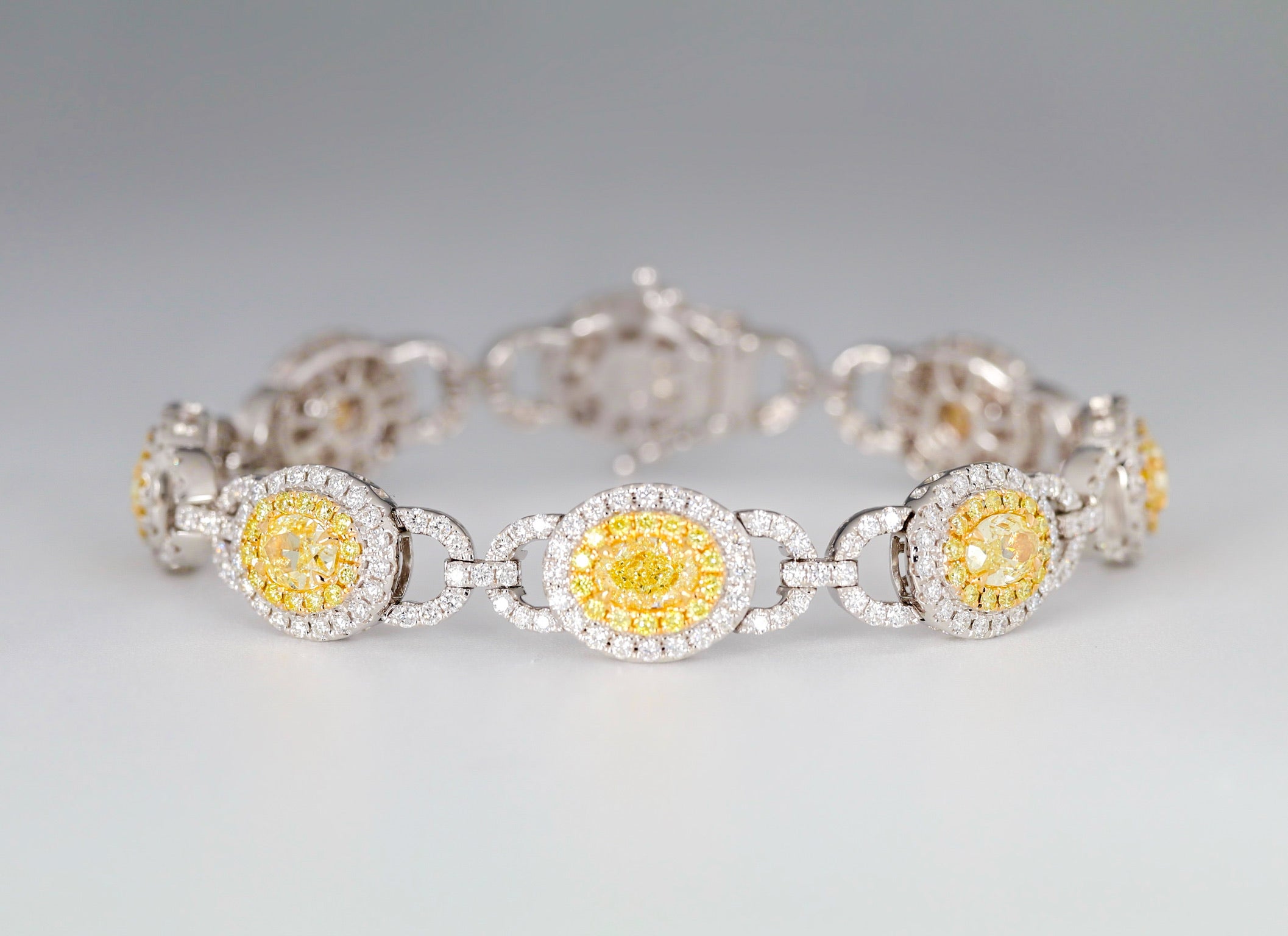 10.89 Carat Oval-Cut Yellow and White Diamond Bracelet, Set in 18K White Gold. For Sale