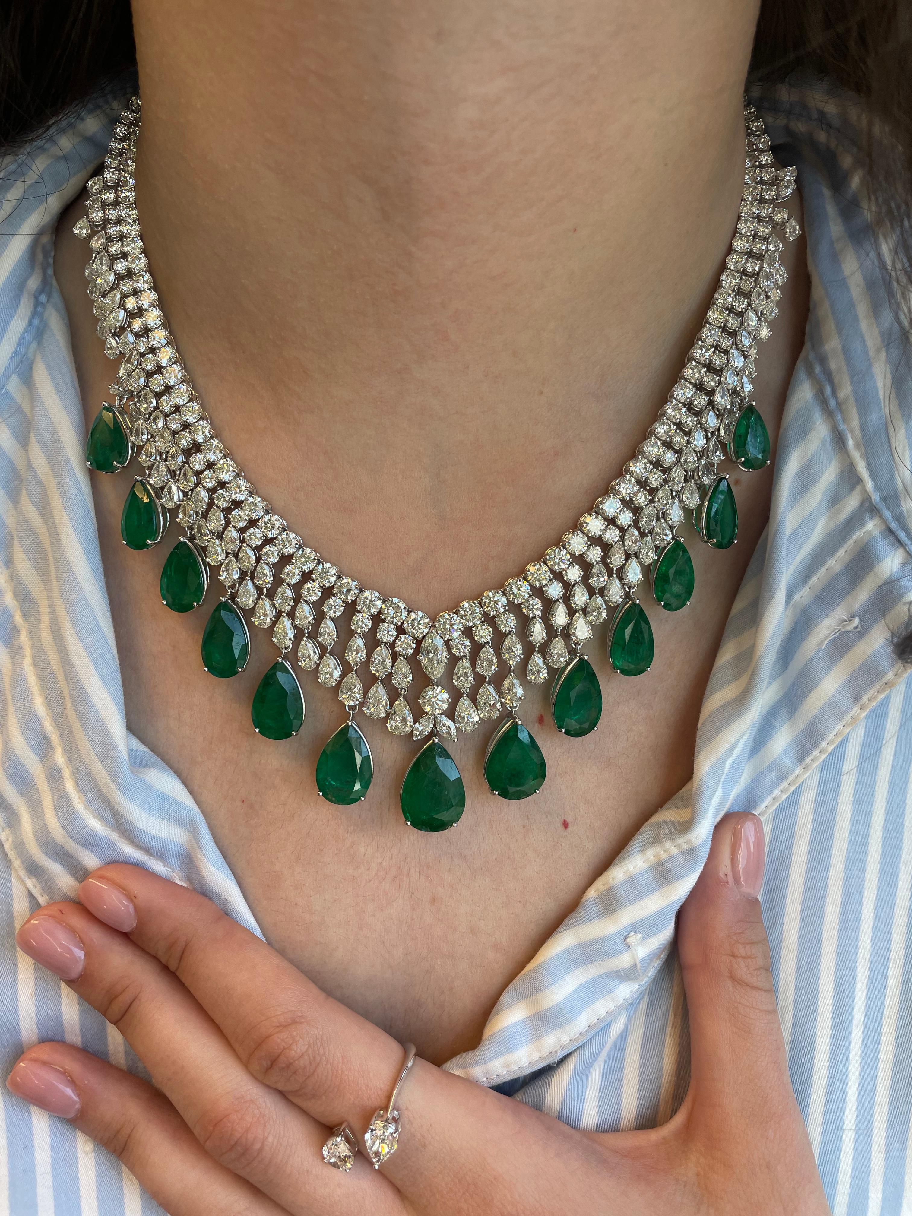 Important grand 108.94ct emerald and diamond necklace. High jewelry necklace, typically created by the major jewelry houses or seen at auction.
13 pear shaped emeralds, 49.14 carats, apx F2. 128 round brilliant diamonds, approximately I/J color and