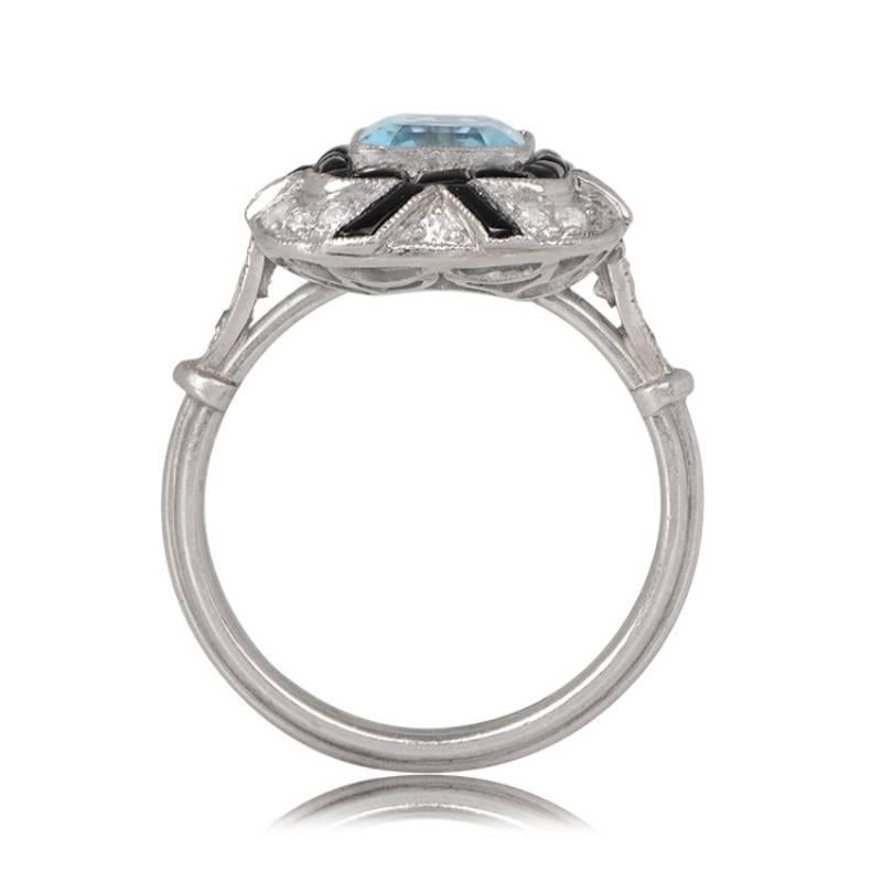 This Art Deco-inspired ring showcases a 1.08-carat Asscher cut aquamarine, accented by onyx and a geometric arrangement of pave-set old European cut diamonds. The diamonds weigh around 0.33 carats and adorn the shoulders, leading to a platinum