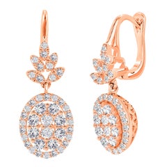 Boucles d'oreilles pendantes en forme de fleur avec un diamant de 1,08 ct en or 14K