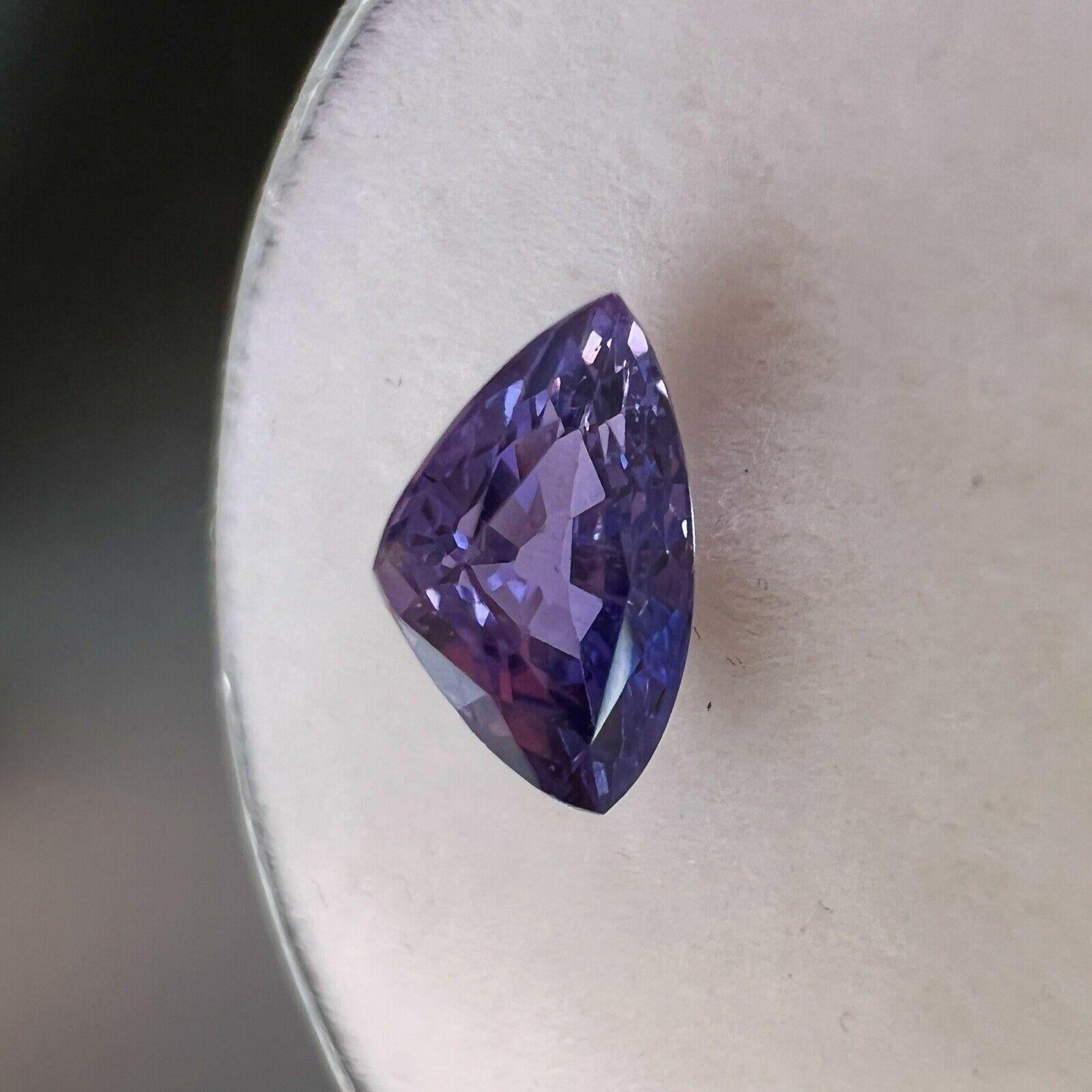 1.08ct Fine Deep Purple Sapphire Trillion Triangle Cut Loose Gem 7.6x4.7mm

Natural Deep Purple Sapphire Gemstone.
1.08 Carat with a beautiful deep purple colour and good clarity, some small natural inclusions visible when looking closely. Also has