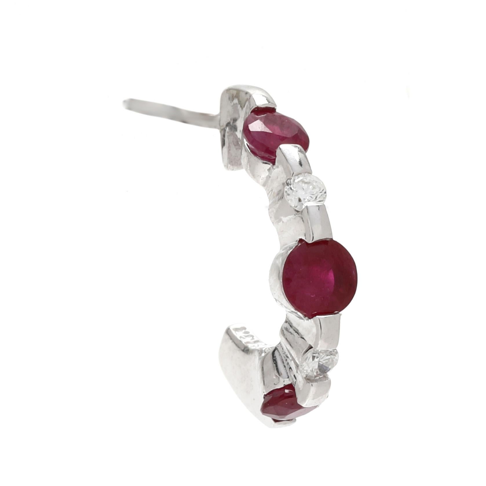 Stones:
ruby,6 stones
round cut
3 - 3.5 mm
approximately 1 total carat
diamond, 4 stones
round brilliant cut
1.75 mm
approximately .08 total carats
FG color/ SI1-2 clarity

Length: 5/8 in.

Width: 3.6 mm

Weight: 1.4 dwts. / 2.1 grams

Stamps: