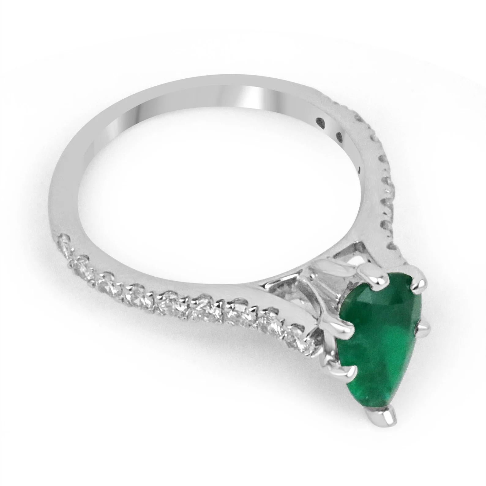 A beautiful dainty rare emerald and diamond ring. This gorgeous piece features a 0.72-carat, natural high quality dark green genuine emerald with phenomenal characteristics. Set within five prongs, and having brilliant round cut brilliant VS