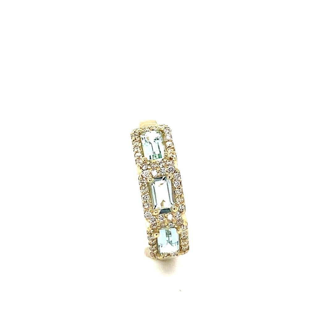 1.09 Carat Aquamarine Diamond Yellow Gold Cocktail Band
Simple yet Elegant.....This classic design is going to elevate your accessory wardrobe!   

Item Specs:

3 Straight Cut Baguette Cut Aquamarines weighing 0.82 Carats
54 Round Cut Diamonds