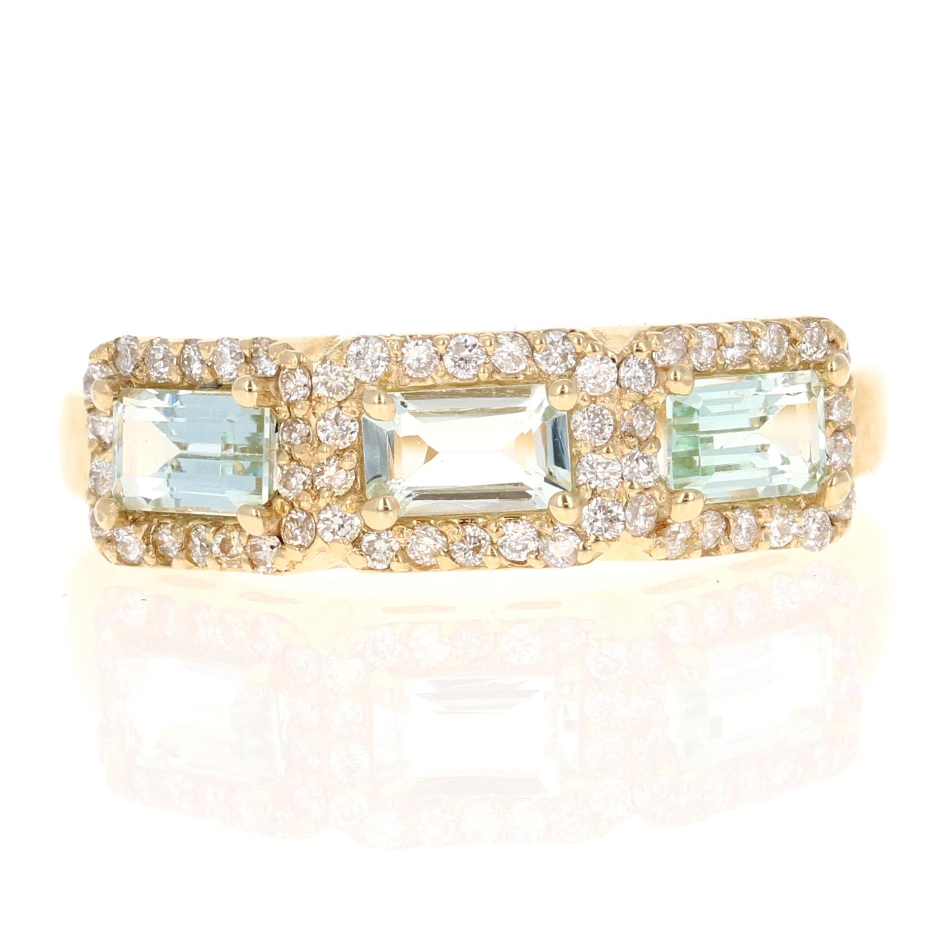 1.09 Carat Aquamarine Diamond Yellow Gold Cocktail Band
Simple yet Elegant.

Item Specs:

3 Straight Cut Baguette Cut Aquamarines weighing 0.82 Carats
54 Round Cut Diamonds weighing 0.27 Carats (clarity: SI1, color: F)
Total Carat Weight is 1.09