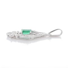 1.09 Carat Emerald with Diamond Pendant Set in 18K White Gold Settings