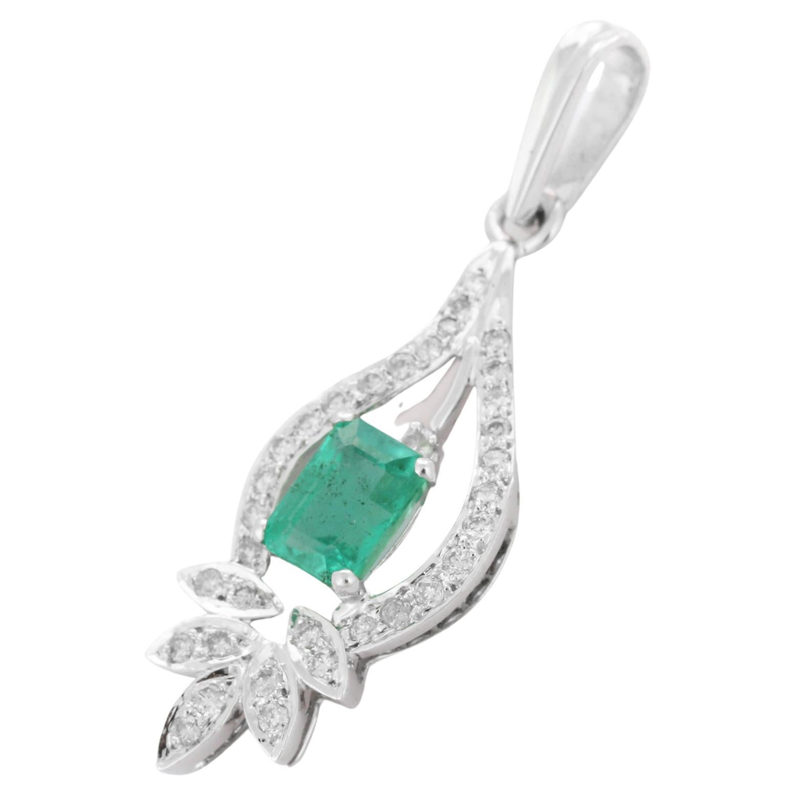 1.09 Carat Emerald with Diamond Pendant Set in 18K White Gold Settings
