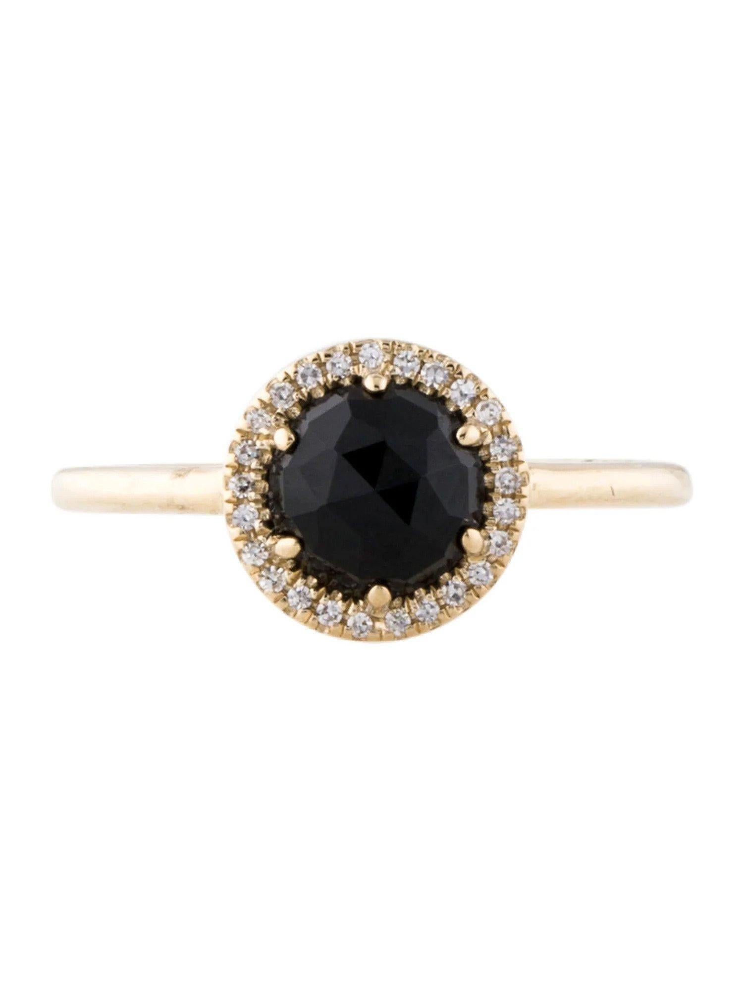 This Black Onyx & Diamond Ring is a stunning and timeless accessory that can add a touch of glamour and sophistication to any outfit. 

This ring features a 1.09 Carat Black Onyx, with a Diamond Halo comprised of 0.06 Carats of Single Cut Round