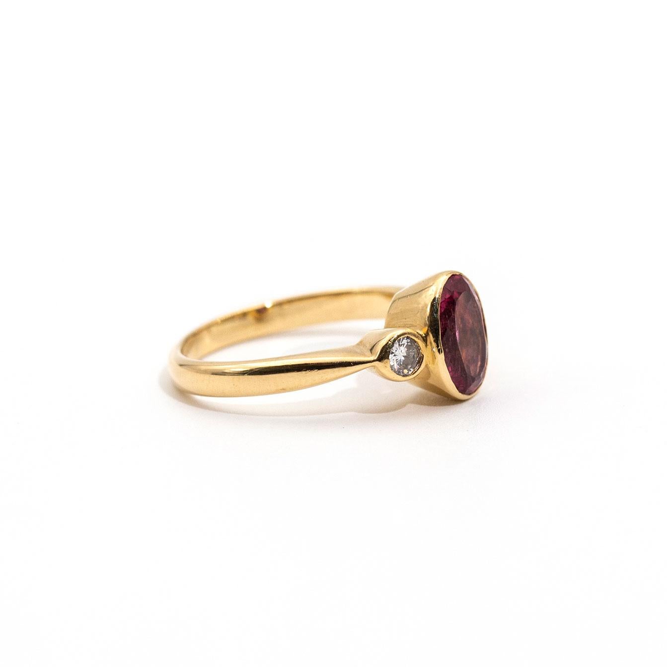 This ravishing ring is forged in 18 carat yellow gold and boasts an eye catching vivid pink 1.09ct tourmaline & is flanked by two round brilliant cut diamonds. We call this beauty The Alexandria Ring.  The Alexandria Ring is a perfect promise ring,