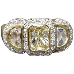 1.09 Carat "Yellow" Emerald Cut Diamond with 2 "Half Moons"