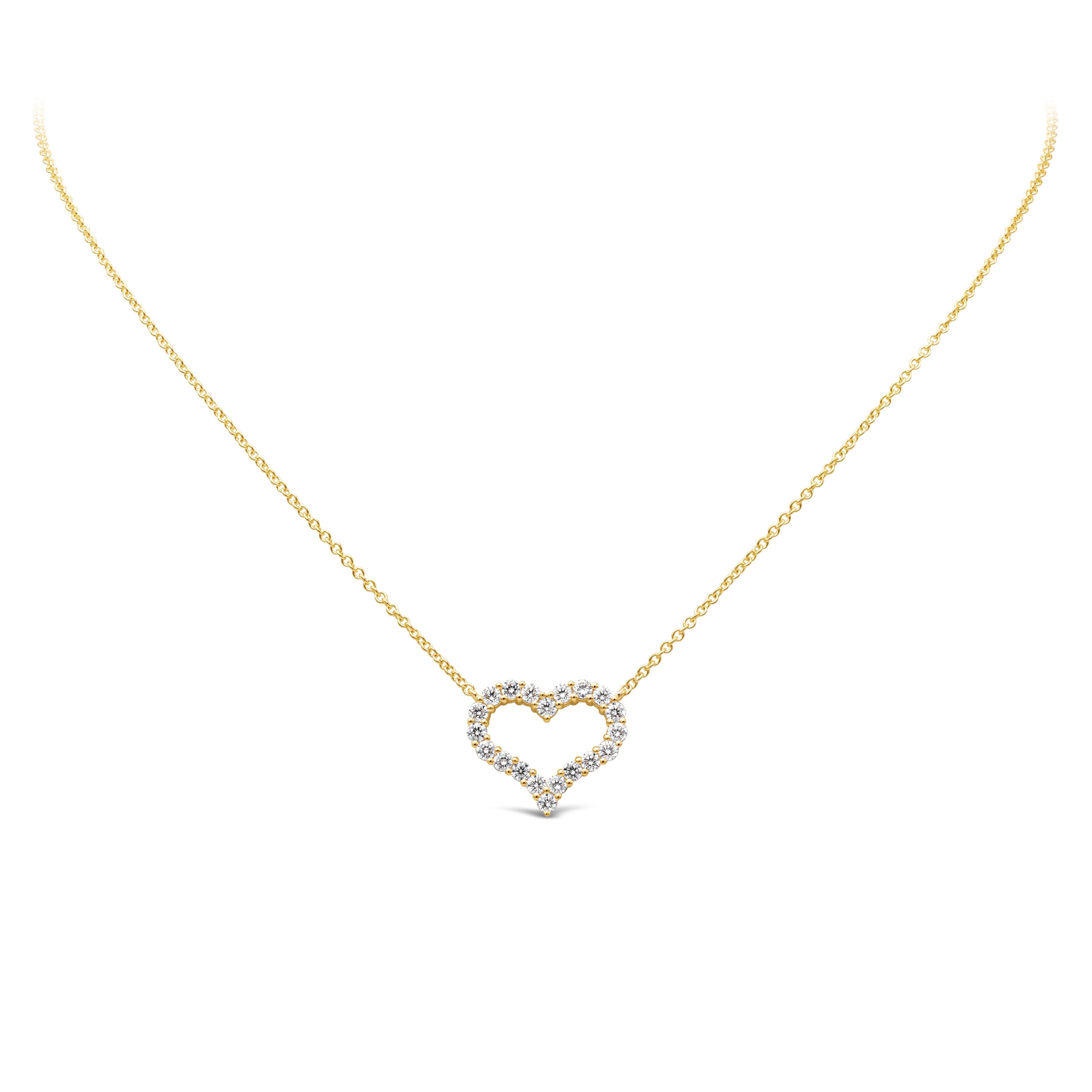 A simple and unique pendant necklace showcasing a row of round brilliant diamonds weighing 1.09 carats total, F color and VS/SI1 in clarity. Set in an open-work heart shape mounting made in 18K yellow gold and shared prong setting. Suspended on an