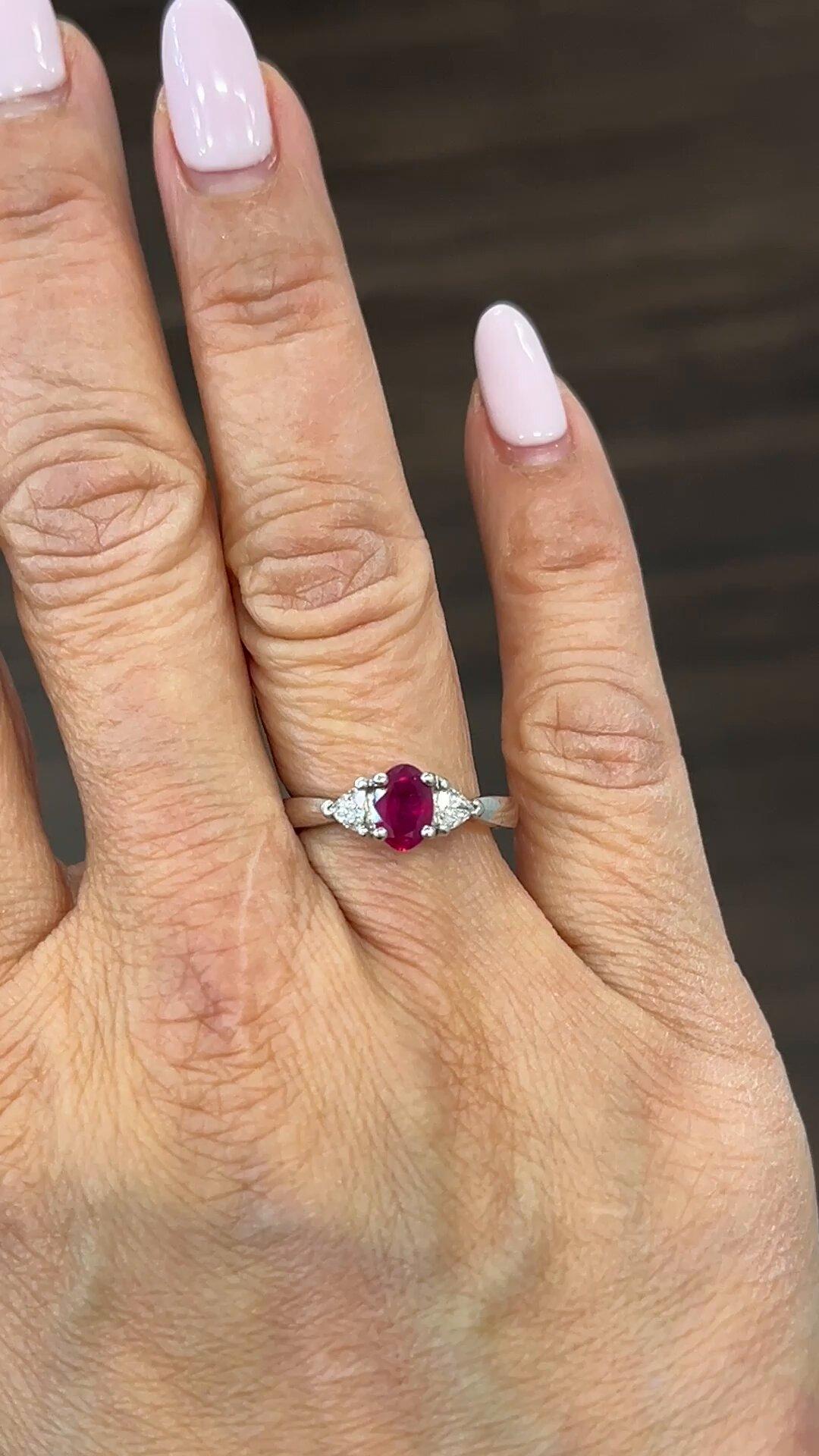 Adorn your finger with this stunning oval-shaped ring that features a 0.87 ct Ruby as the main stone and diamonds as secondary stones. The metal used in crafting this exquisite jewelry is platinum, making it resilient and long-lasting. This ring is