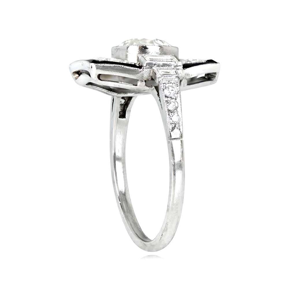 Geometric engagement ring with a 1.09 carat old European cut diamond center stone (K color, VS1 clarity) bezel-set in platinum. Accented with diamonds and a natural onyx halo, the ring also features baguette cut diamonds on each shoulder and
