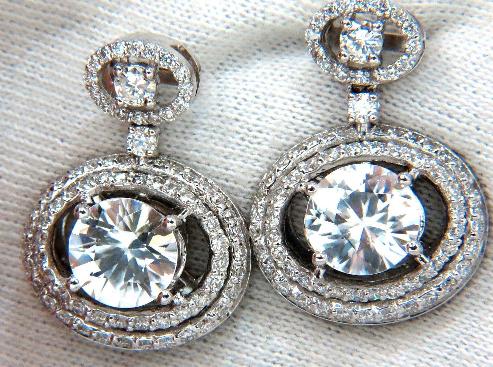8.10ct. Natural Matching round zircons 

& 2.80ct natural diamonds earrings.

Zircon, clean clarity & transparent.

9.2mm diameter

brilliant in all angles.



2.80ct. Round Brilliant full cut diamonds.

G-color Vs-2 clarity

Overall earrings
