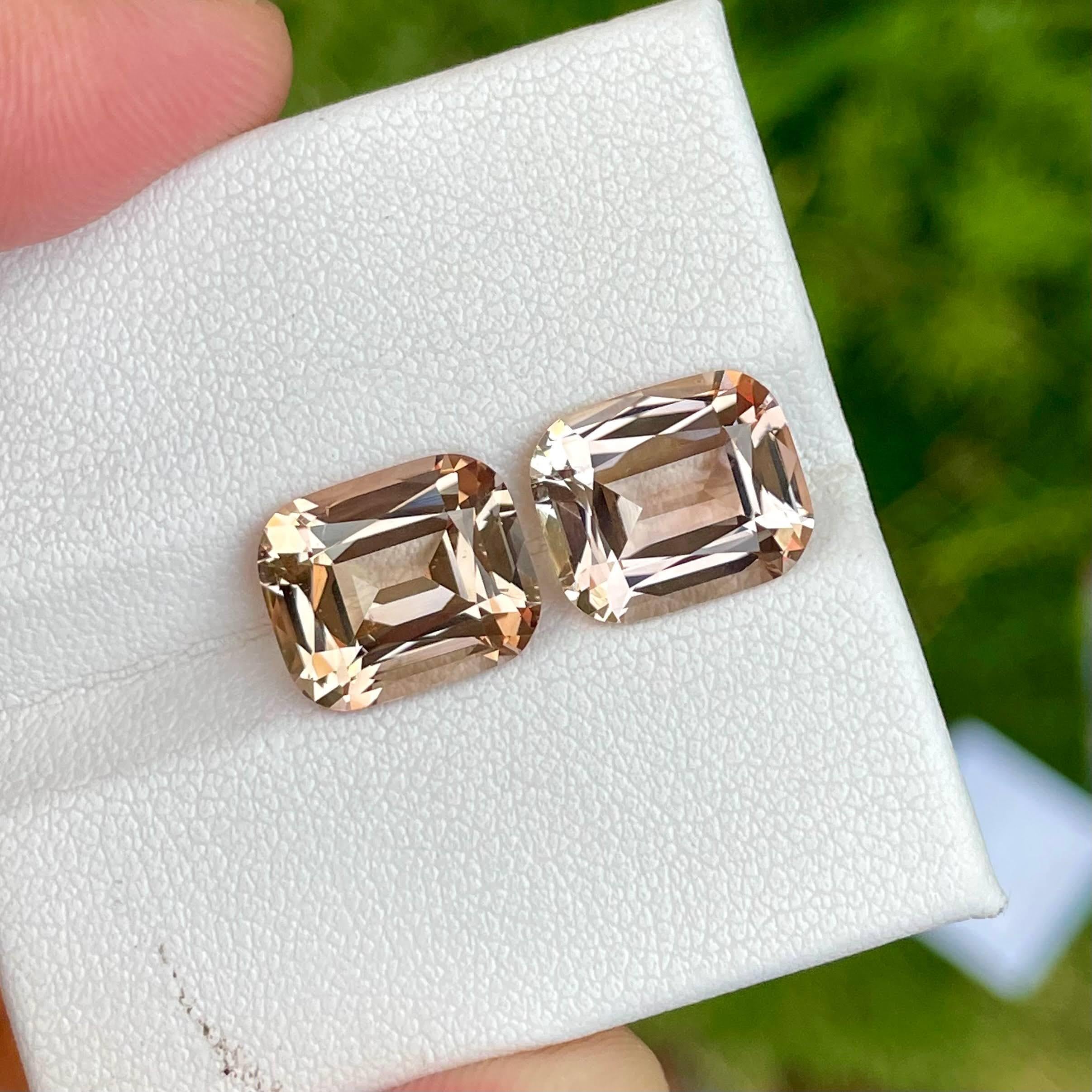 Weight 10.90 carats 
Dimensions 11.35x9.5x6.0 mm 
Treatment none 
Origin Pakistan 
Clarity eye clean 
Shape cushion 
Cut fancy cushion 



This exquisite pair of natural Topaz gemstones, each weighing 10.90 carats, showcases the unmatched beauty and