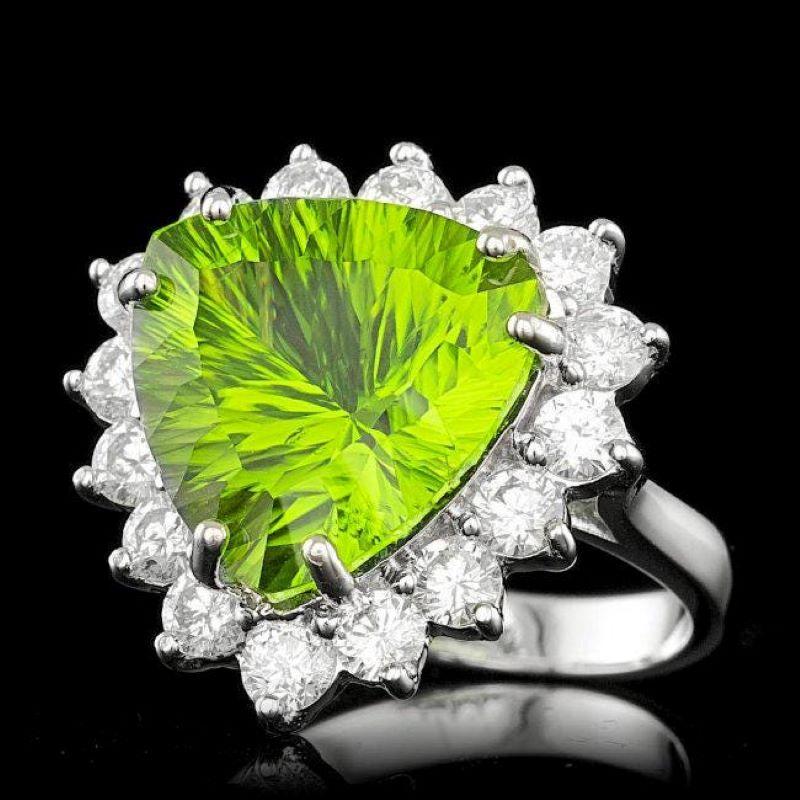 10.90 Carats Natural Peridot and Diamond 14K Solid White Gold Ring

Total Natural Triangular Peridot Weight is: Approx. 9.40 Carats 

Peridot Measures: Approx. 14 mm

Natural Round Diamonds Weight: Approx. 1.50 Carats (color G-H / Clarity