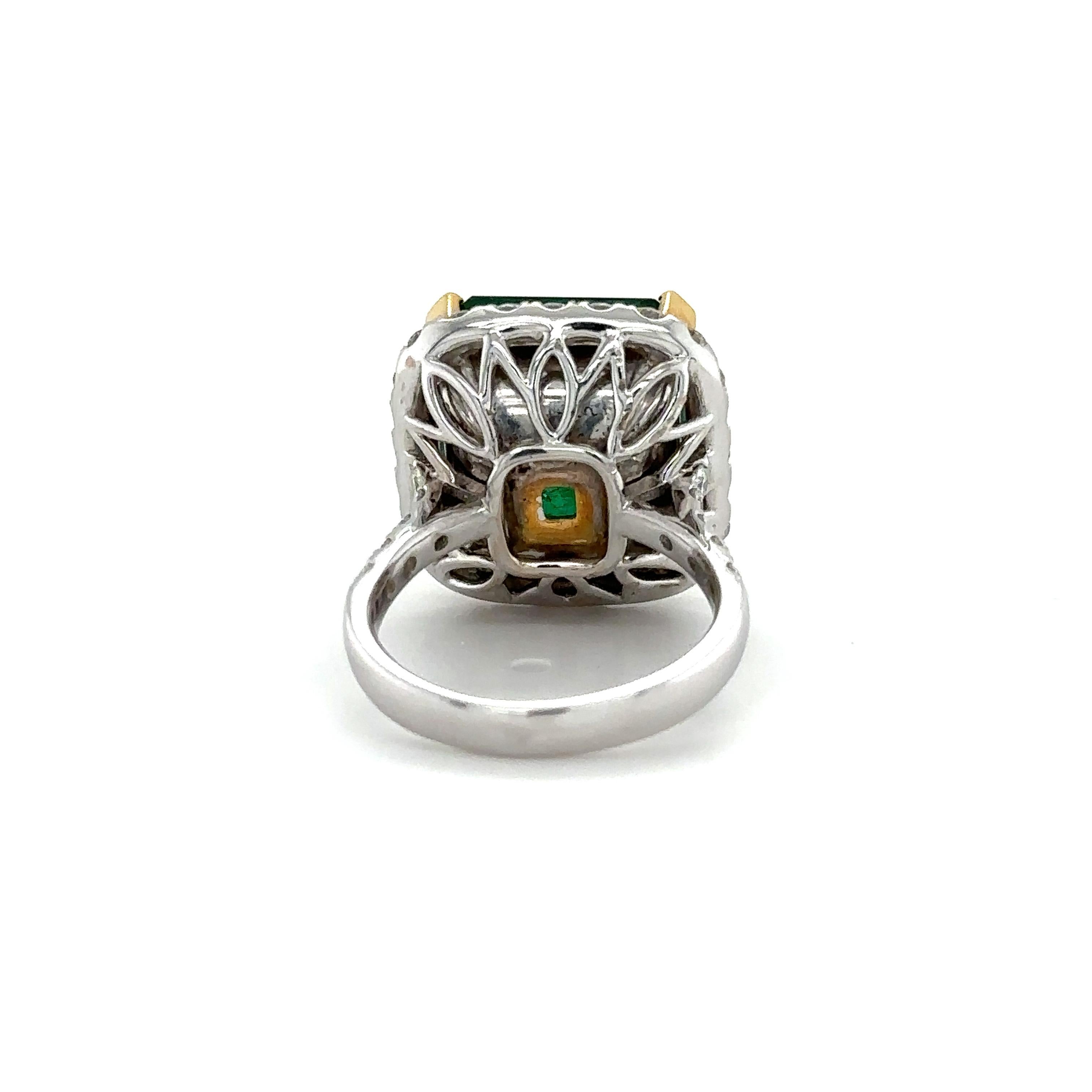 This breathtakingly beautiful ring is a true masterpiece, made from a combination of 18k white and yellow gold, this ring features a stunning 10.93ct Emerald-cut Zambian Emerald at its center. The Emerald is a true standout, with a vivid green color