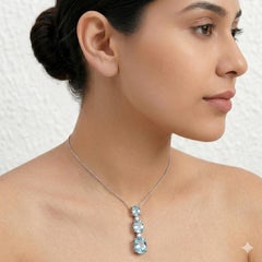 10.97 Collana in oro bianco con diamante rotondo e acquamarina