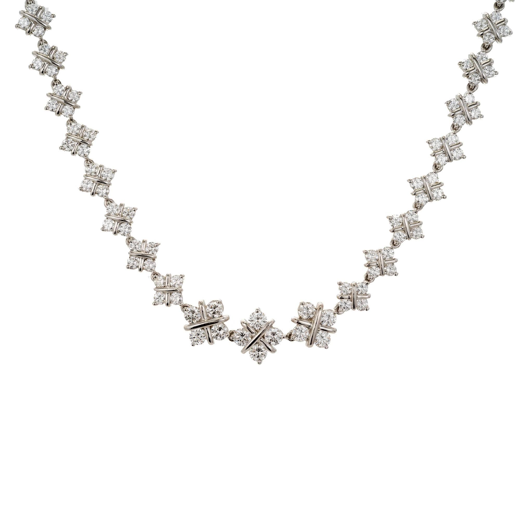 Solid platinum diamond necklace with 10.98 carats of ideal round diamonds in a graduated handmade wire X link. 15 Inch Length. Hidden built in catch and underside safety.

196 round diamonds full cut F-G VSI approximate total carats 10.98
Total
