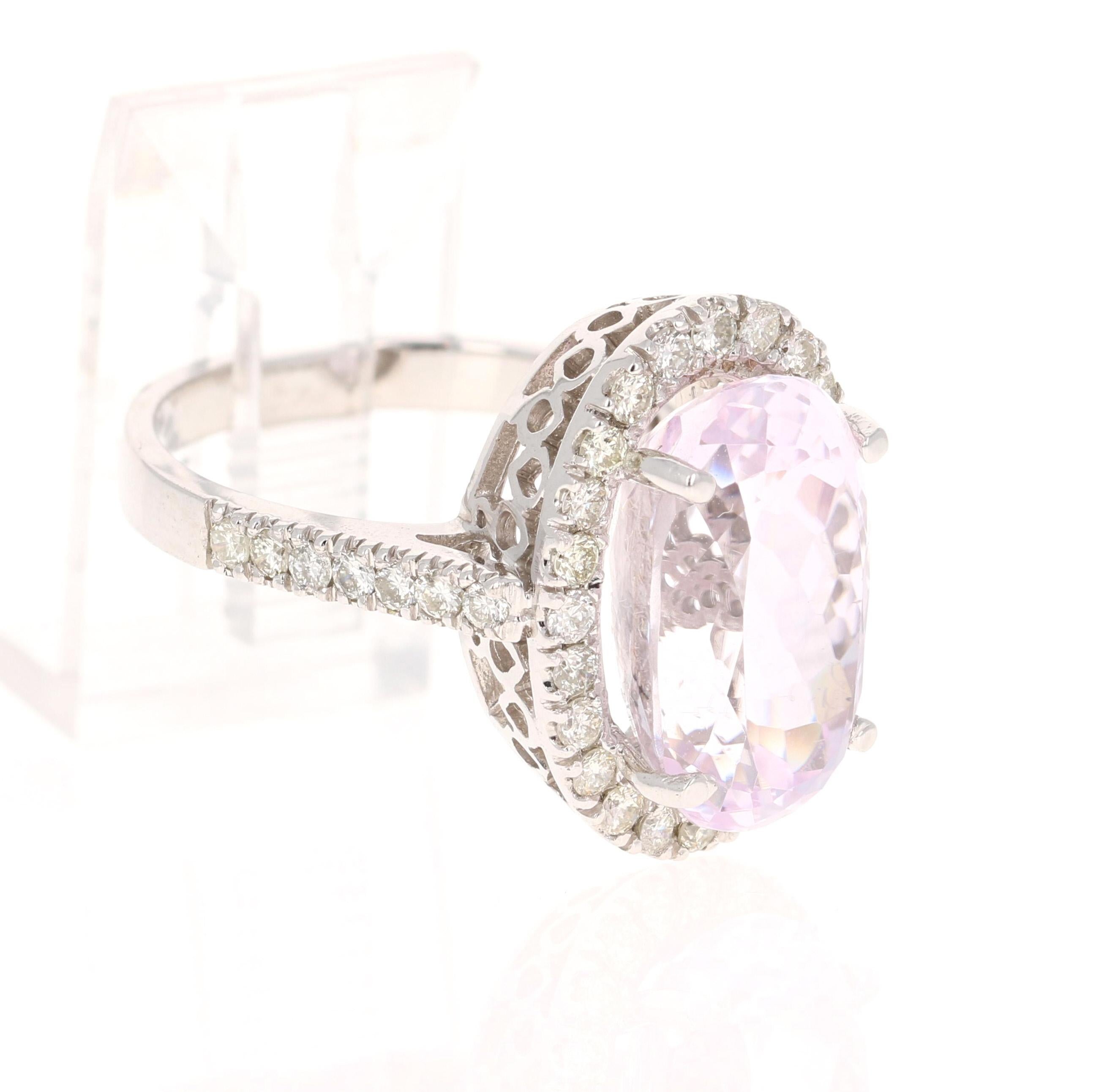This beauty has a large Oval Cut 10.15 Carat Kunzite and is surrounded by 38 Round Cut Diamonds that weigh 0.84 Carats. (Clarity: SI, Color: F) The total carat weight of the ring is 10.99 Carats.
The Oval Cut Kunzite is 9 mm x 15 mm.
The ring is