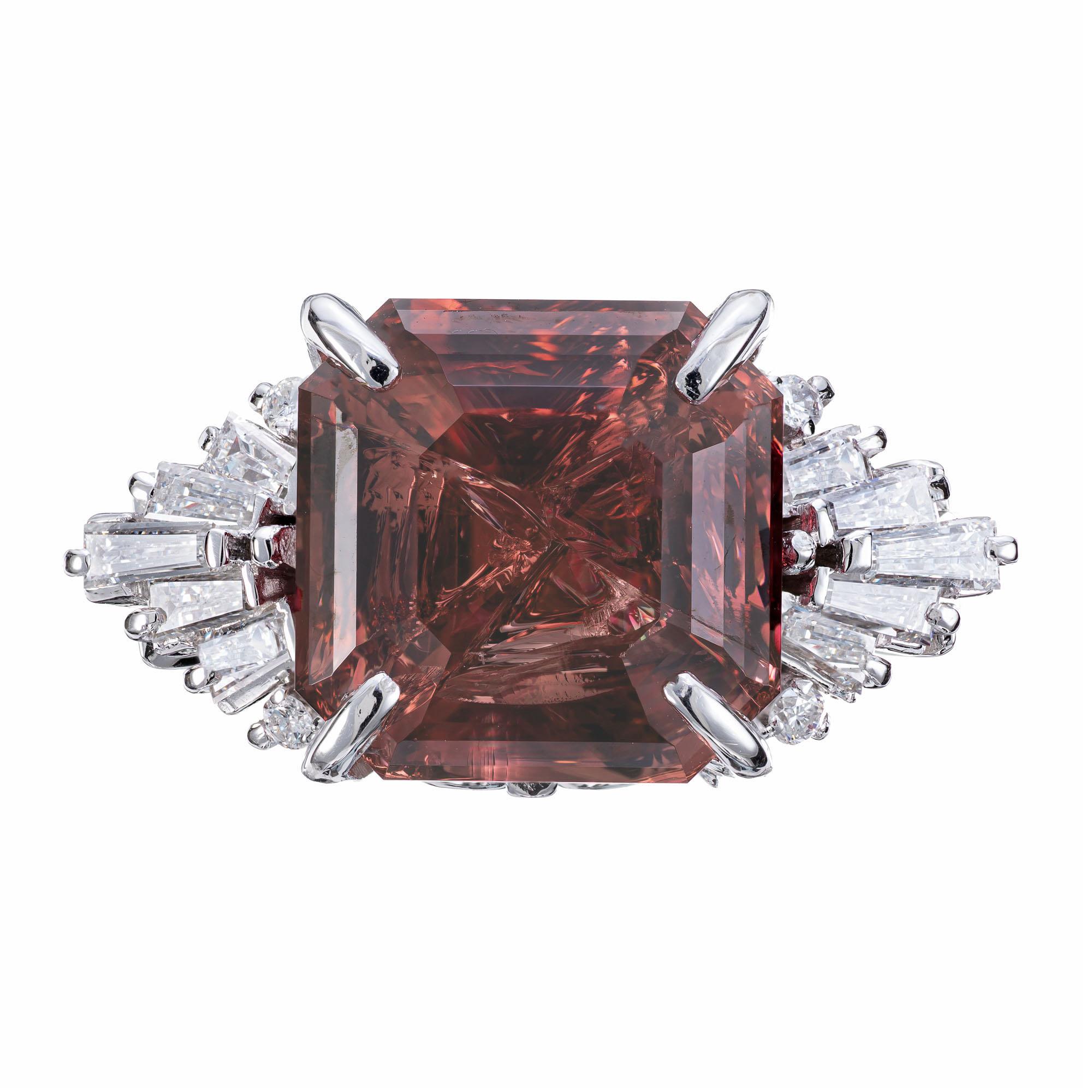 Garnet and diamond engagement ring. AGL certified 10.99ct brown orange/pink, natural Garnet center stone, set in a platinum setting with tapered baguette and round full cut accent diamonds. The garnet has elements of Pyrope Almandite and Spessartite