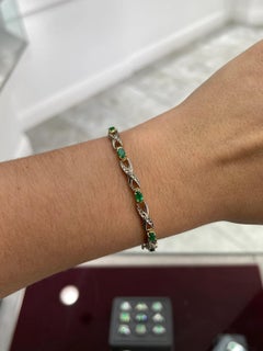 1.09tcw 14K Colombian Emerald Oval Cut & Diamond X Two Toned Gold Bracelet